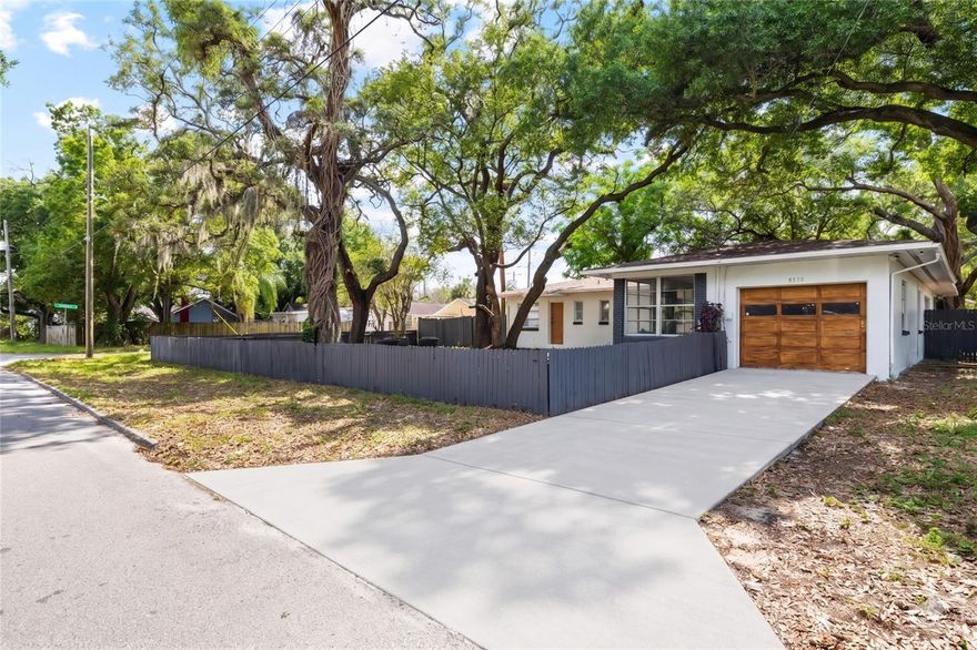 One or more photo(s) has been virtually staged. Rare find in Tampa! Renovated 3-bedroom, 2-bath home with 1,795 heated sq. ft., a huge bonus room, 1-car garage, and a fully fenced 10,000 sq. ft. corner lot. The lot and layout are the standouts here, offering the kind of space, flexibility, and functionality that are hard to find at this price point.

Inside, the home features a comfortable and practical layout with generous living areas and a huge bonus room, perfect for entertaining, a second living space, game room, home office, guest area, or flex room. Renovations include brand-new kitchen cabinets, new flooring, fresh interior paint, updated fixtures, and a remodeled bathroom. Major updates include a new AC in 2026 and roof in 2023, giving buyers added peace of mind. Flood zone X, no HOA provides additional peace of mind and lower costs. 

The outdoor space is one of the home’s best features. The oversized corner lot is fully fenced, with an additional fence separating the front and back yards for added flexibility. Enjoy room for pets, play, gardening, entertaining, parking, or simply spreading out. The awesome back porch is perfect for relaxing, grilling, or gathering with friends and family. The home also offers two convenient entrances, including the front driveway and a side entrance leading to a cute porch.

Located in Tampa’s 33604 area with no HOA, this home is minutes from ZooTampa at Lowry Park, Busch Gardens, Adventure Island, USF, Moffitt, MOSI, Seminole Heights restaurants and breweries, shopping, dining, I-275, Downtown Tampa, Ybor City, Carrollwood, Tampa International Airport, and Gulf beaches. A great opportunity for buyers looking for a renovated Tampa home with space, an oversized fenced lot, a garage, and easy access to so much of what Tampa has to offer.