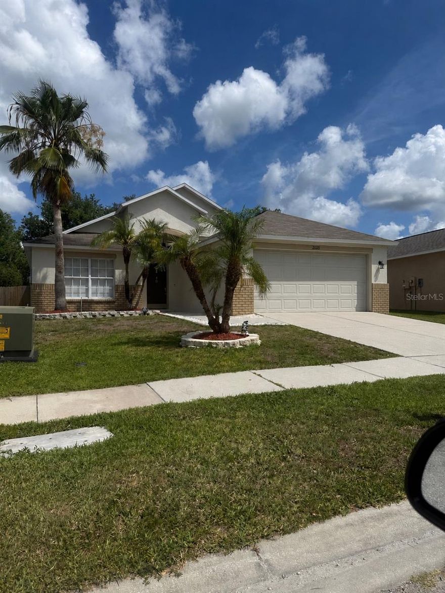 Don?t miss this one.  4 bedroom, 2 bath home in sought after location near Tampa Premium Outlets and with NO CDD AND LOW HOA!! Everything has been done-move right in! Roof 2018- AC 2017- Brand New 2020 Tankless Water Heater- Fridge 2018. Smart home features! Including smart doorbell, smart garage opener,  irrigation system, outside lights on smart switch, and smart thermostat! Entry leads to open floor plan with great room layout and split bedroom floor plan. Ceramic tilethrought ! Front room is perfect as an office or bedroom (has closet). Large kitchen with white cabinetry and stainless steel appliances including French door fridge! You?ll love the modern wood look tile throughout the majority of the home in the living spaces and bedrooms. Open formal dining room or flex space and great room with French doors out to covered, screened lanai. Huge fenced yard!! Owner suite with walk in closet, en suite bathroom with  double sink vanity! (Open the mirrors for more hidden storage!!) Two more bedrooms with shared bath. Perfect location in the heart of everything growing Wesley Chapel and Land O Lakes areas have to offer. Close to interstates and in top rated school zones.