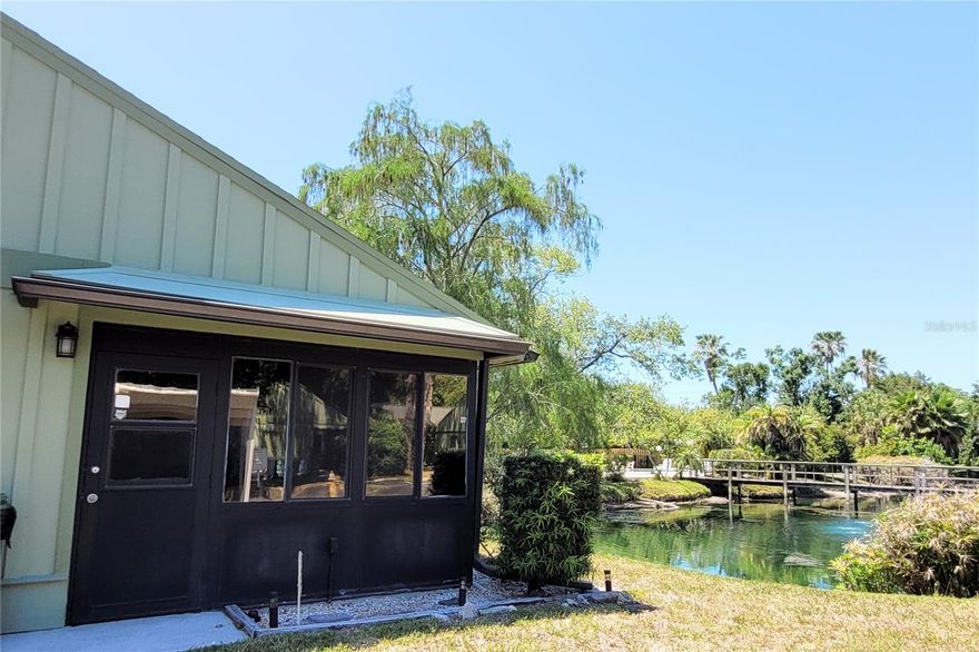 Spectacular Sarasota end-unit villa offering 2 bedrooms and 2 bathrooms, perfectly positioned with a 1-car carport conveniently located near the unit entry. Enjoy serene pond views from the primary bedroom, living room, and glass-enclosed lanai, creating a peaceful and private retreat. Features include a screened front entry leading into a welcoming foyer, a spacious kitchen with eat-in area and breakfast bar, and an in-unit laundry closet with full-size washer & dryer. Additional highlights include a large exterior storage closet, security system, central vacuum, impact glass windows, and major updates with a new AC (October 2023) and hot water heater (February 2022). Offered as an estate sale and sold with all contents in the unit and storage closet. Residents also enjoy access to a community pool and a prime location just minutes from Gulf beaches, the Ringling Museum, Sarasota-Bradenton International Airport, and vibrant downtown Sarasota.