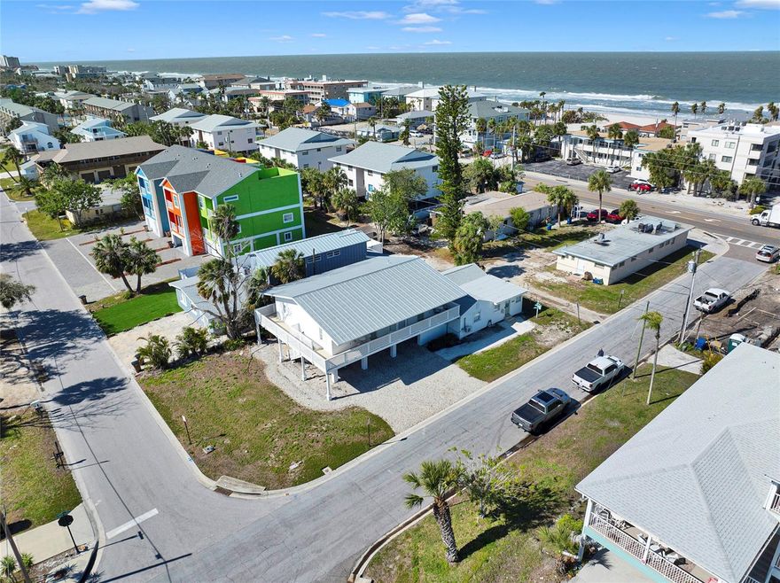A Beach Lovers Paradise - Just Steps from Indian Rocks Beach! This exceptional property offers the ultimate beachside retreat. Indian Rocks Beach is one of Pinellas County's most sought-after destinations for vacation renters from around the world. The property features three distinct, beautifully designed living spaces: Main Building (Raised Duplex) The primary living area showcases high ceilings and an open-concept layout, creating a spacious two-bedroom, one-bath residence. A large wrap-around balcony offers stunning views of the Gulf and the sunset. The main space includes a fully equipped eat-in kitchen and a generous family room with a built-in entertainment center. The second raised unit is an exquisite one-bedroom, one-bath suite with its own family room and efficiency kitchen. These living areas can be seamlessly combined to create a luxurious three-bedroom, two-bath suite or used independently for added privacy and flexibility. Each of the units has been thoughtfully designed with premium finishes. Notable features include: Stunning Calacatta Gold Quartz countertops, custom hardwood cabinetry, and brand-new stainless-steel appliances in each fully stocked kitchen, convenient coffee bars and Keurig machines in every unit, Elegant custom vanities with Delta Gold plumbing and trim, hotel-style glass shower doors, and fully stocked bath and bed linens, comfortable queen sofa sleepers, USB charging nightstands with bedside lamps, and 60-inch smart TVs New mini-split AC units, Nest thermostats, and high-end, scratch-resistant, waterproof flooring Freshly painted interiors and exteriors, new siding, updated sliders, and custom window treatments. Charming Beach Cottage (Ground Level and has been fully gutted to help with remediation) The separate beach cottage is a cozy two-bedroom, one-bath retreat with a beautifully appointed kitchen. This home has never flooded prior to this 1 in 100 year flood. New laundry facilities with full-sized washer and dryer units are easily accessible to tenants. Outside, enjoy the newly installed patio pavers, an outdoor dining area with an attached grilling station, and a variety of beach supplies, including sports equipment, fishing poles, and wagons all provided for your convenience and enjoyment. This property is an absolute must-see, turnkey and ready for you to enjoy immediately! Whether you're a savvy investor, seeking a personal beach getaway or in the market for a high-performing rental property, this gem offers unmatched potential. (PORTFOLIO PACKAGE AVAILABLE; Property can be purchased with 122 Coral Ave, Redington Shores and/or 2605 Bay Blvd, Indian Rocks Beach)
