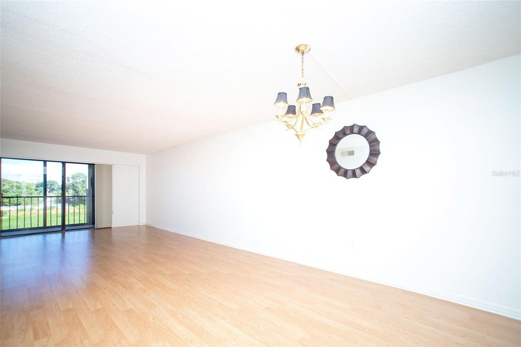 Photo of 9490 Harbor Greens Way #306, Seminole, FL 33776 (MLS # TB8546838)