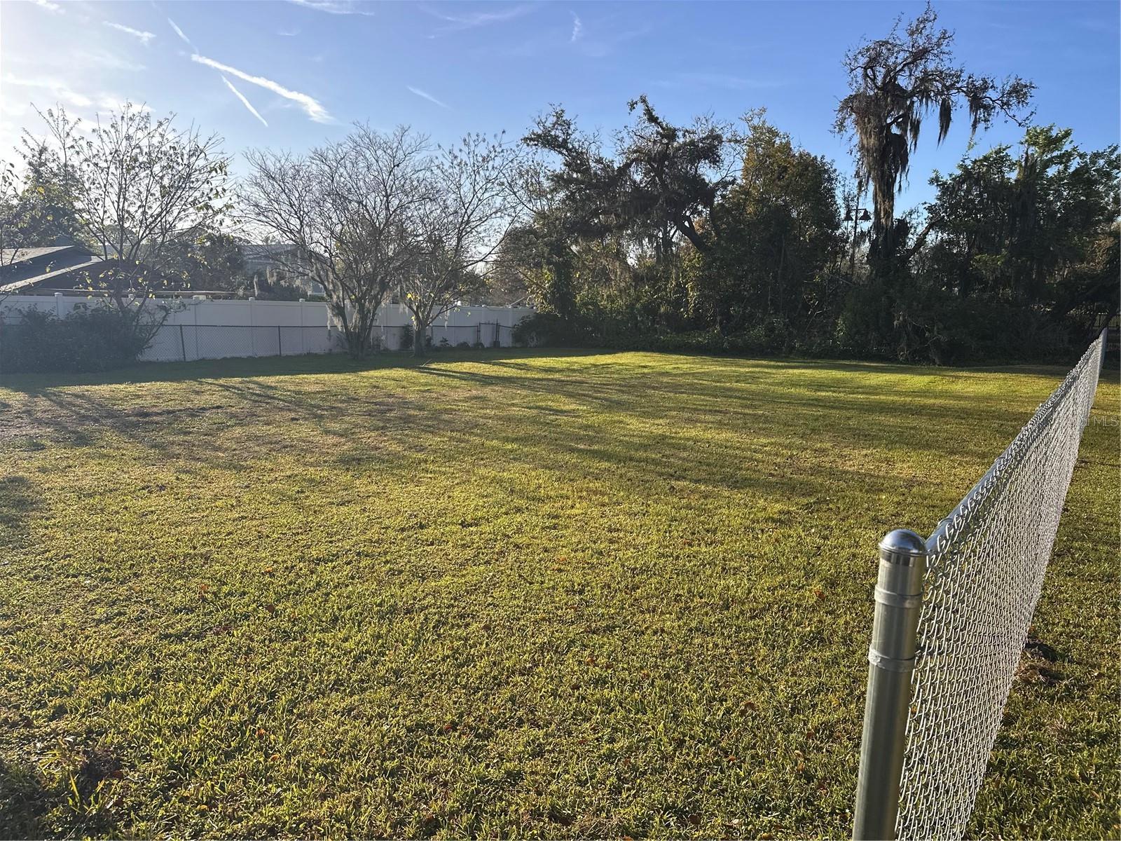 Discover the perfect canvas for your dream home with this cleared and ready-to-build vacant lot nestled between 203 and 211 Glenwood Drive in the desirable North Lakeland area. Boasting beautiful green grass and a prime location, this lot offers convenience and accessibility to all the essentials. Enjoy being less than a mile from Lake Parker Park for outdoor recreation, just 2 miles from Publix Plantation Square for convenient shopping, 1.4 miles from Tiger Stadium for sports enthusiasts, and only 1 mile from Home Depot on 98 N for all your home improvement needs. With easy access to Lakeland Square Mall and the countless dining, shopping, and entertainment options along 98 N, plus being less than a mile from I-4, it’s the ideal spot for commuters traveling to Orlando or Tampa for work. This exceptional property is ready for you to build the home of your dreams!