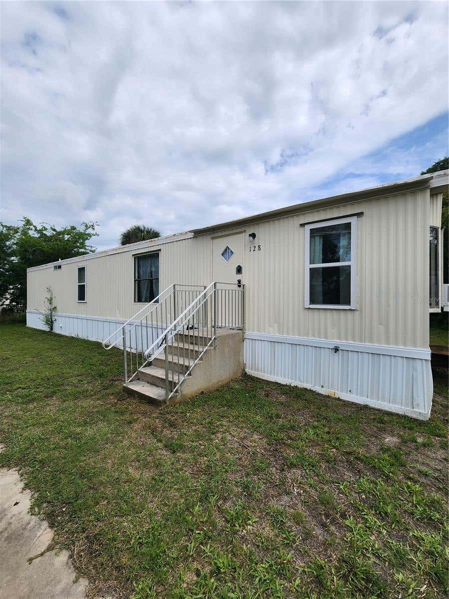 Photo of 128 Center Street, Oak Hill, FL 32759 (MLS # NS1088404)