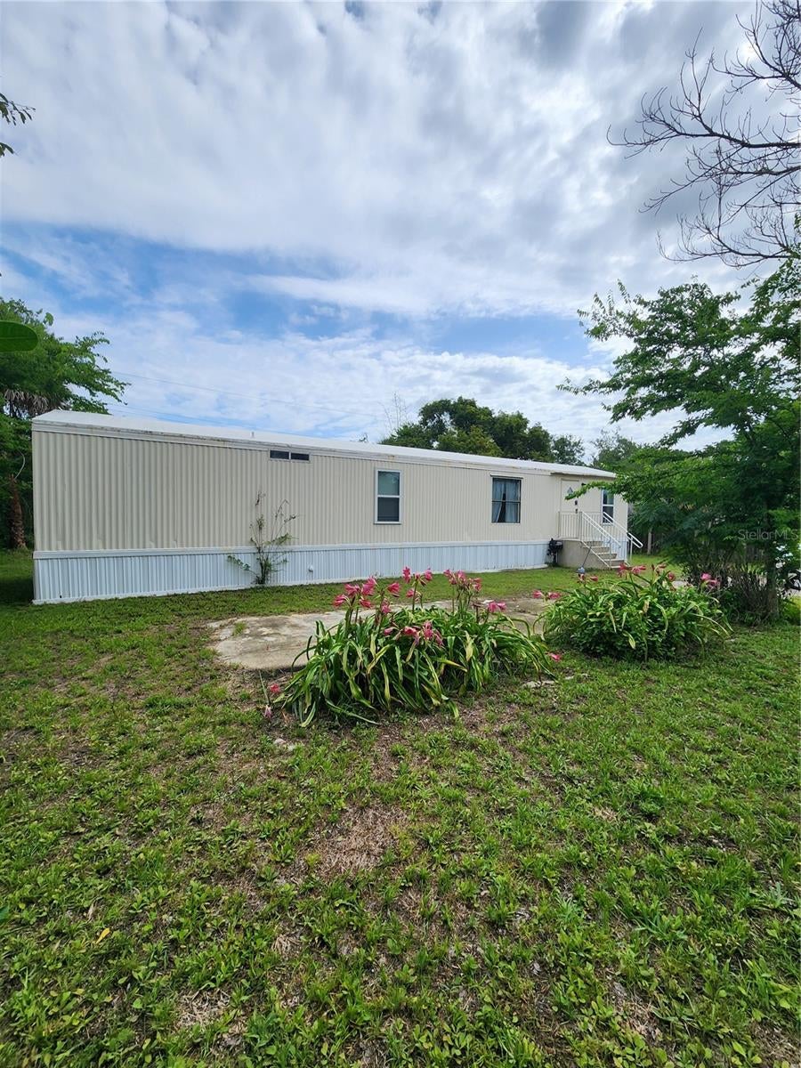 Photo of 128 Center Street, Oak Hill, FL 32759 (MLS # NS1088404)