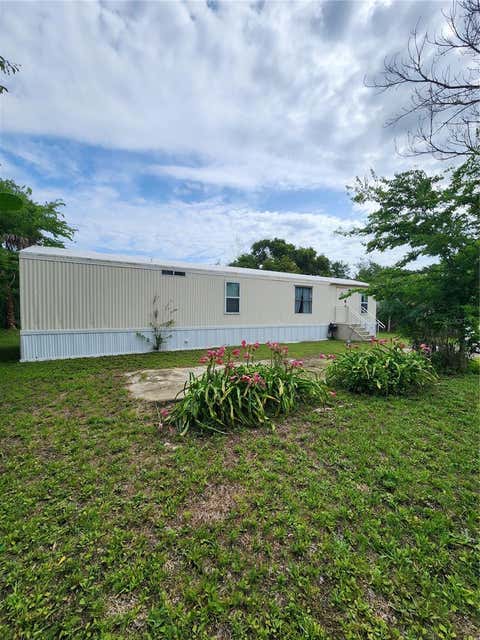 Photo of 128 Center Street, Oak Hill, FL 32759 (MLS # NS1088404)