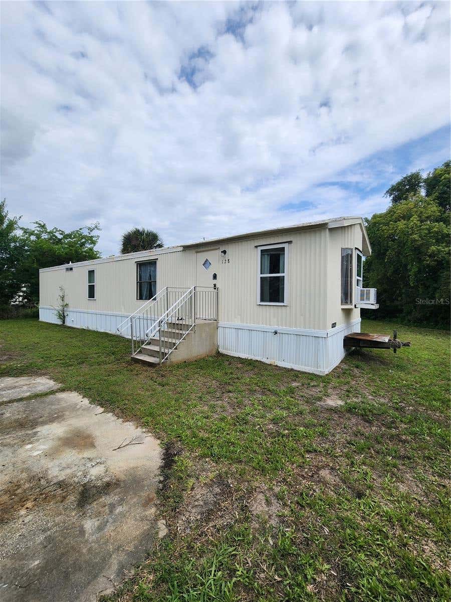Photo of 128 Center Street, Oak Hill, FL 32759 (MLS # NS1088404)