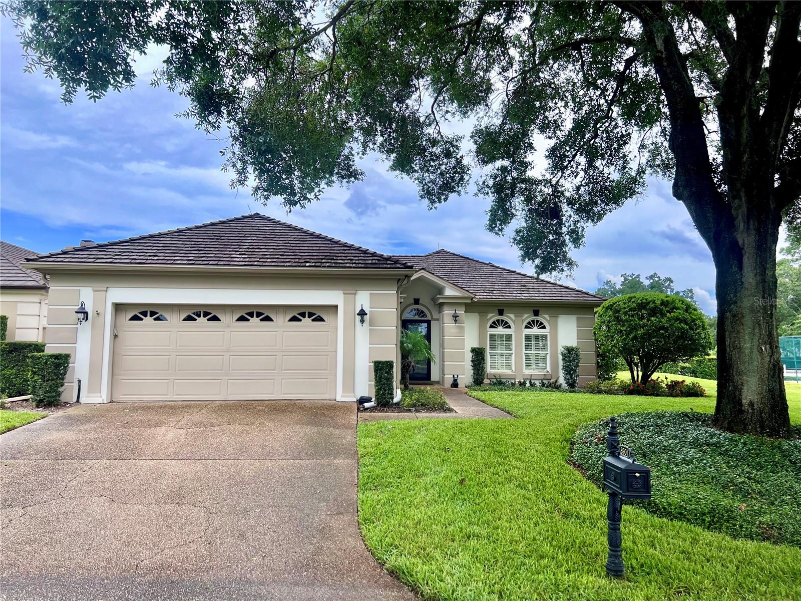 Photos coming soon - Welcome to this charming villa located in the peaceful, park-like setting of Bay Hill Village. Tucked within a gated community in the heart of Dr. Phillips, this well-maintained 3-bedroom, 2.5-bath home offers a relaxed and easy lifestyle. Enjoy community amenities including tennis courts with pickleball adaptation, a community pool and hot tub, a fully appointed clubhouse and the convenience of grounds maintenance included in your association fees.
Well located within the neighborhood, the home is in pristine condition and features a spacious layout with thoughtful upgrades throughout. Highlights include custom cabinetry, granite countertops, a water filtration system, solar panels for energy efficiency, and tile flooring throughout the main living areas. A spacious bonus room offers flexibility as a home office, media space, or family room, while the dining area features a built-in wet bar with a wine cooler, perfect for entertaining.
Step outside to your private outdoor retreat, complete with a waterfall fountain, putting green and your own hot tub. An awning provides shade for sunny afternoons, making this a great space to unwind or spend time with friends and family. The screened-in porch extends your living space and provides a peaceful spot to enjoy the outdoors in comfort.
Living in Bay Hill Village means being part of one of Orlando’s most established and desirable communities. Residents enjoy direct access to Arnold Palmer’s Bay Hill Club from a private rear gate, and the convenience of being close to top-notch restaurants, top-rated schools, shopping, and theme parks. It’s a location that combines calm residential living with nearby city perks.
