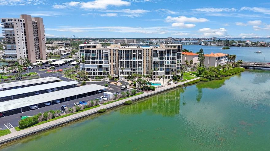Discover elevated coastal living in this completely redesigned 2-bedroom, 2-bathroom penthouse-level condominium, perfectly positioned on the top floor of The Ambassador mid-rise. Offering breathtaking, unobstructed ocean views from nearly every room, this exceptional residence blends modern elegance with the laid-back charm of beachfront life. Recently renovated throughout, the home features new flooring, fresh contemporary paint, sleek appliances, and the convenience of an in-unit washer and dryer. Expansive windows flood the space with natural light and frame spectacular sunrise and sunset vistas. The open-concept living and dining area is ideal for entertaining or relaxing, while the primary suite serves as a serene retreat with stunning water views, a spacious en-suite bathroom, and ample closet space. A versatile second bedroom is perfect for guests, a home office, or a creative studio. This unit also comes with a storage unit on the same floor for additional space. Residents of The Ambassador enjoy an impressive array of resort-style amenities, including multiple sparkling pools, a private marina with boat slips and docking, a hot tub, clubhouse, fitness center, tennis courts, and secure gated entry. Best of all, the pristine beach is just a 5-minute drive away, putting the best of coastal living right at your fingertips. With premier dining, shopping, and entertainment nearby, this top-floor gem is a rare opportunity to own a move-in-ready home in one of the area's most desirable communities. Schedule your private showing today and discover the perfect blend of luxury, location, and lifestyle! Matterport virtual tour available - https://my.matterport.com/show/?m=V6R8PQKSTHD