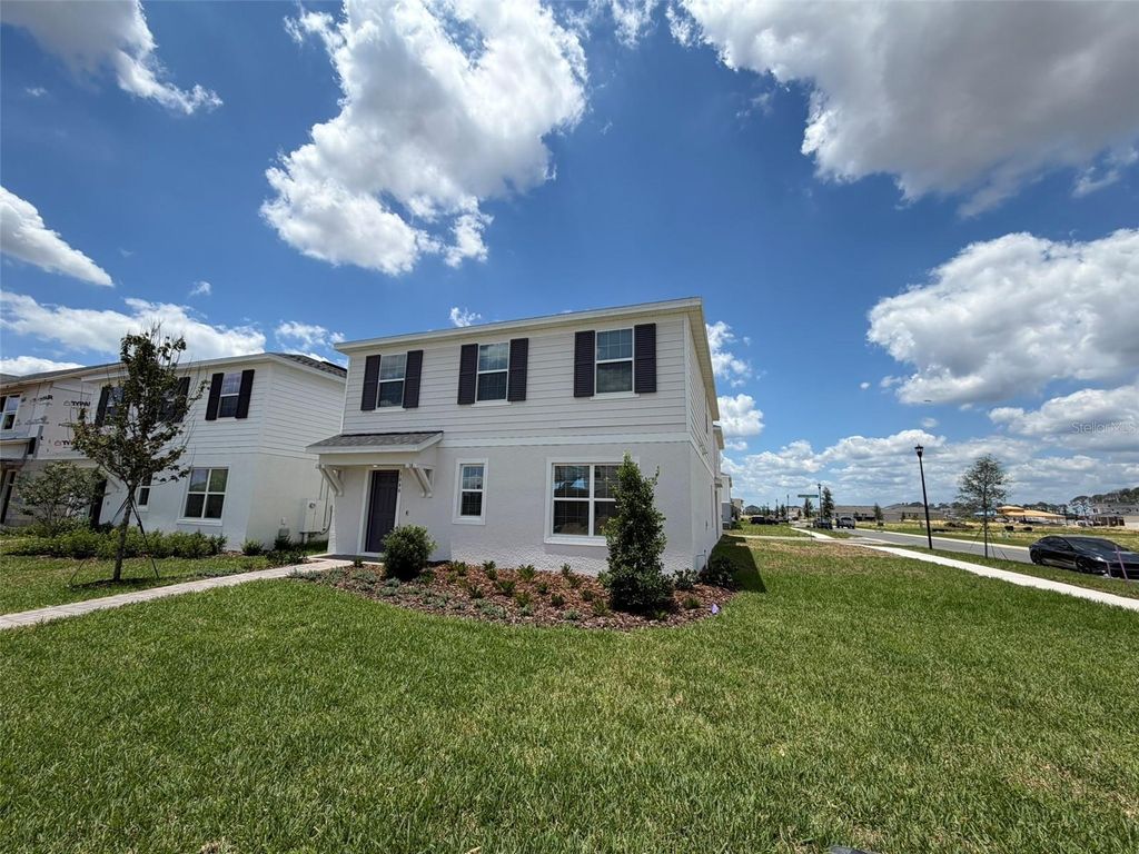 Photo of 5646 Enchanted Meadow Aly Mdw, Clermont, FL 34714 (MLS # O6408345)