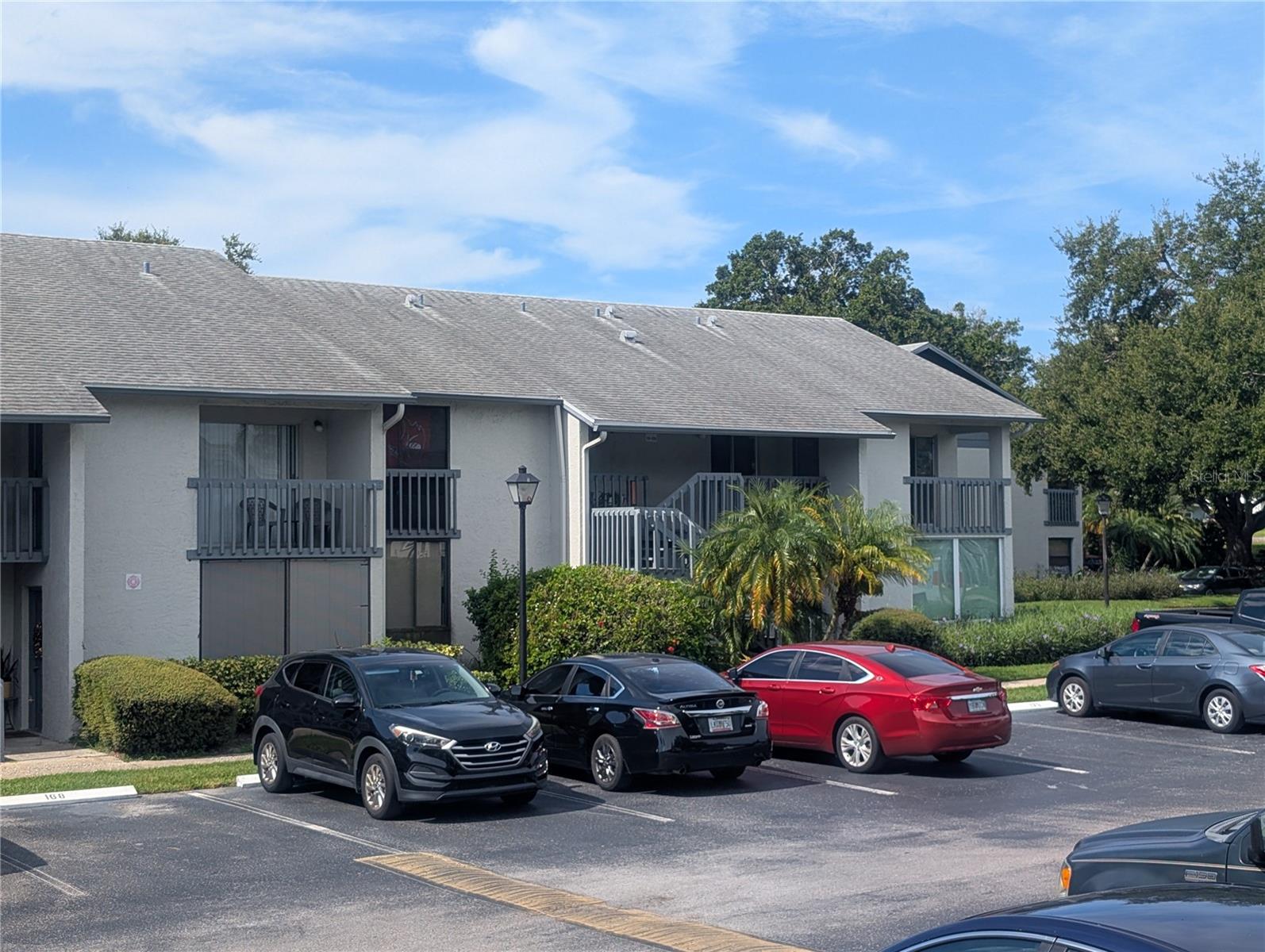 SPACIOUS 1-Bedroom 1-Bath (775 htd. sqft) UPSTAIRS - END UNIT (no elevator) in desirable ALL AGE & PET-FRIENDLY complex of "Shadow Lakes" (built in 1983) off 113th St. in NO FLOOD - NO EVACUATION ZONE - is in the process of getting a make-over, including all fresh paint and new laminate flooring throughout! Strictly SOLD AS IS! Lovely pond views from large screened balcony with storage room, 2 pair of sliding glass doors leading into the great room and into a huge bedroom with walk-in closet. Hallway stackable washer/dryer convey. Some kitchen appliances are missing and age of A/C unknown, newer water heater. This vibrant community offers two swimming pools, and a covered deck with BBQ grills for outdoor gatherings. One designated open parking spot and pool are conveniently located just steps from your front door. Monthly dues of $419.- include: water, sewer, trash pickup, Internet, cable TV, common areas, lawn care, building exteriors including roofs & building insurance - just pay for your electric! 3-MONTH MINIMUM RENTAL policy. Nestled in the heart of Largo, 10 minutes from new Seminole City Center with fitness studio, stores, movie-theater, restaurants, pet-store, Emergency Care facility, banks, Seminole Rec Center, Post Office, and St. Pete College. Close to parks, Largo Mall, Largo Cultural Center, 20 min. ride to Tampa International Airport and delightful GULF BEACHES. Current owner is disabled & tax-exempt. Don't miss a chance to call this affordable unit your new home!