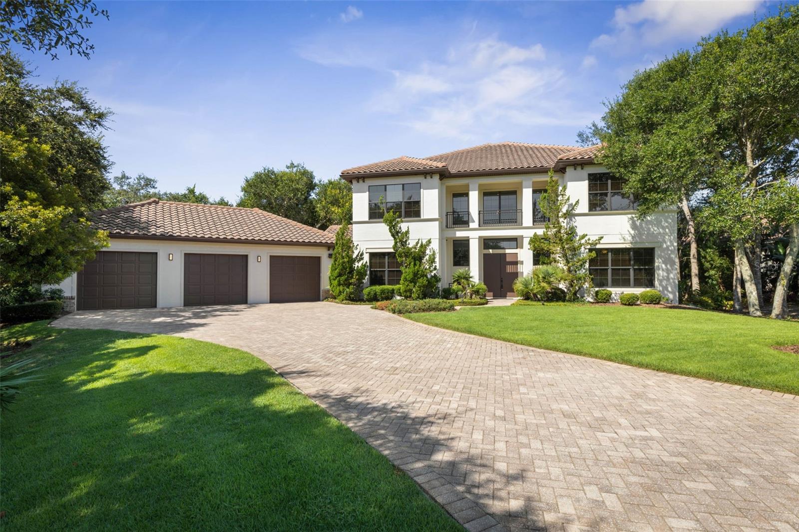One or more photo(s) has been virtually staged. Nestled on a quiet cul-de-sac in the prestigious Northshore Estates community, this luxury 5-bedroom, 4-bathroom home offers 4,079 square feet of beautifully designed living space on an oversized private lot surrounded by tranquil wooded views. Combining timeless elegance with modern functionality, this home is perfectly situated near Hammock Beach Resort, golf courses, pristine beaches, and top-rated schools in Palm Coast, Florida.
Step inside to soaring ceilings, elegant crown molding, and tile flooring that set the tone for upscale living. The open-concept layout features a spacious living room with a gas fireplace, a formal dining room with wainscoting, granite buffet, and wine fridge, and a gourmet chef’s kitchen equipped with granite countertops, stainless steel appliances including a gas range, a walk-in pantry, and a sunny breakfast nook. The main level also includes a full-sized laundry room, plus two bedrooms—one with an en-suite bath and direct access to the patio, ideal for guests or multi-generational living.
French doors lead to a resort-style screened travertine patio with a heated pool and spa, creating the perfect setting for outdoor living, entertaining, or simply unwinding in privacy.
Upstairs, the luxurious primary suite offers three closets, dual vanities, a walk-in shower, and access to a screened balcony with serene views. A spacious media room with wet bar and mini fridge, plus two additional bedrooms and a second laundry room, provide plenty of space for family and guests.
Additional highlights include a 3-car garage with shark coating and extra storage room, and optional Hammock Beach Club membership offering world-class amenities such as championship golf, pools, tennis courts, dining, spa services, and more.
This exceptional Palm Coast home for sale blends luxury, space, and coastal convenience in one of the area’s most sought-after neighborhoods. Schedule your private showing today and experience the best of Florida coastal living.