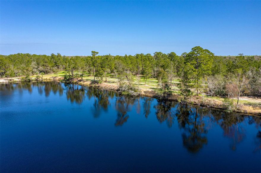 Checkout the video of this beautiful property at www.thebluffsatlakevolco.com 
The Bluffs at Lake Volco is a 60 acre parcel of pristine land with a private 10 acre lake located in the coastal community of New Smyrna Beach/Edgewater. Go to TheBluffsatLakeVolco.com for the video tour.   This unique waterfront property is on the market for the very first time and has the potential for multiple home sites, a family compound, recreational retreat, or just one exclusive home.  Owning this property would offer you the opportunity to swim, fish, boat, relax, or even bike on the rails to trails paved bike path that is adjacent to this property.  Entering the property through the gated access on the county paved road you will see the beauty of this unique property and the magnitude of its size.  Over 1/2 mile of road frontage and 1/3 mile of lake frontage this property offers endless possibilities for use.  It's central location allows for quick access to the beach, intracoastal, downtown shopping and restaurants, schools, I-95, I-4, and multiple local airports as well as multiple international airports within an hour.  Set your appointment today to see this RARE and UNIQUE waterfront property before it is gone. Go to TheBluffsatLakeVolco.com for the video tour and further information.  A total of 5 parcels are included in the sale of the 60 acres.; Cleared: Partial