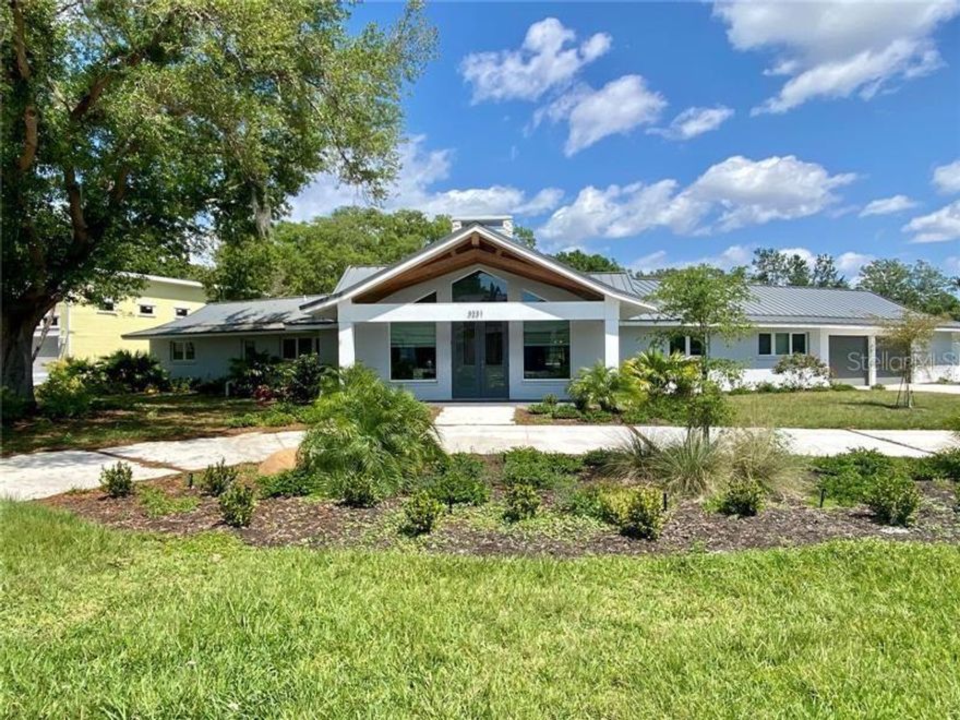 Welcome to your Oasis in Sarasota! This incredible 4 bedroom, 3 bathroom Fully Remodeled home sits on nearly 3 Quarter of an ACRE in the highly sought-after Old Forest Lakes community!  With nearly 4,000 square feet of updated living space, as well as all the creative thought put into this one including a 4-DOOR PASS THROUGH GARAGE so you never have to back in your truck or BOAT ever again!!! This Gorgeous estate blends elegance and convenience perfectly. Step inside to find a custom lit entry way for Art Lovers. Entering the living space you are greeted with HIGH ceilings, and Gorgeous features such as a Fully renovated kitchen with seperate Laundy room and Pantry. Custom made BAR off the Dining Room! Complemented by upgraded bedrooms and bathrooms throughout the home. One of the highlights is the luxurious master suite with its huge Walk-In Closet and Fully customized En-Suite Bathroom. Also.... NO MANDATORY HOA Fee. THis HOME IS THE ONE!!! Location is PRIME with it being just Minutes from beaches, top-rated schools, shopping, and dining. CALL TODAY!!!