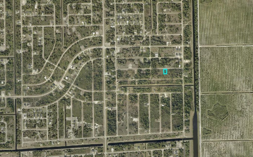 Photo of 1240 Hilliard Street E, Lehigh Acres, FL 33974 (MLS # A4691112)