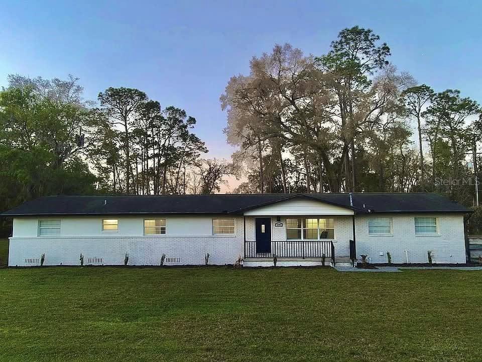 Welcome to this beautifully updated 4-bedroom, 2.5-bathroom home located near the heart of Silver Springs. Nestled on a spacious 0.6-acre lot, this home has a perfect blend of modern amenities and timeless charm. Key Features: Energy Efficient: New A/C and a smart Wi-Fi thermostat as well as a new water heater. Gourmet Kitchen: Features a large kitchen with granite countertops, stainless steel appliances, featuring a double oven and extensive cabinetry with soft closes throughout. Open Concept Living: Bright and airy living spaces with energy efficient windows that flood the home with natural light. Master Suite Retreat: Master bedroom features direct access to the back patio/pool area, and spa-like ensuite bathroom featuring a triple head rain shower and a dual vanity with an anti-fog LED mirror. Resort-Style Backyard: Enjoy a sparkling 42,000 gallon 20'x40' 10' deep pool and a large patio with a built-in fire pit—perfect for entertaining. Home Office Bonus Room: Ideal for remote work, a playroom, or a fitness space. Laundry: Huge 9x18 laundry with tall ceilings—plenty of space for air conditioned storage. Bring your toys or RV: Massive 36x40 concrete pad with 220v service to store your boat and RV, or install your own steel garage. 12x20 shed/workshop with power that includes a roll up door for easy access for all of your projects. Prime Location: Located in a quiet neighborhood with schools, and shopping nearby. Just down the street from the historic Fort King national landmark—constructed in 1827, the fort has tours and a blacksmith shop used by early settlers, as well as scenic trails. Only 6 minutes away is the beautiful Silver Springs State Park—A 5000 acre park that has crystal clear waters from one of America’s largest springs where you can experience a glass bottom boat tour, kayak the five-mile Silver River, or explore the Silver River Museum and Cracker Village. The park also has camping, hiking, dining and shopping as well. Don't miss the opportunity to own this exceptional home! Schedule your private tour today.