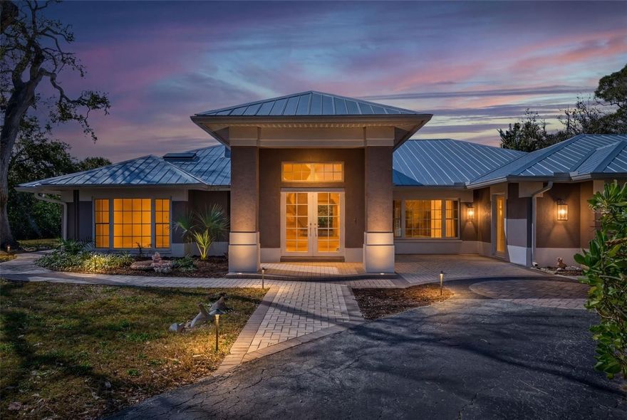 A rare opportunity situated on an expansive 1.8 acres, this estate is located behind the gates of one of Siesta Key’s most exceptional estate settings. Surrounded by lush tropical foliage and serene lagoon-style water features, the property offers remarkable privacy and versatility with a 5-bedroom, 4-bath main residence and a separate 2-bedroom, 1-bath guest house—ideal for multi-generational living, hosting guests, or providing dedicated staff accommodations. The grounds evoke a secluded, natural sanctuary while remaining just minutes from Siesta Key’s vibrant dining, boutique shopping, and world-renowned coastline.

Positioned within the prestigious Sanderling Club, the estate grants access to one of Sarasota’s most storied and sought-after communities. Celebrated for its historic bay-to-gulf setting and architectural significance, the Sanderling Club offers residents private beach access, 24-hour gated security, tennis and pickleball courts, a beach front clubhouse, and a members-only marina just steps from the property—delivering a refined coastal lifestyle unlike anywhere else.

Located moments from the iconic, powder-soft sands of Siesta Beach, this property presents a rare chance to create a legacy residence in an extraordinary setting. Whether you choose to enhance the existing homes or envision an entirely new custom masterpiece, the possibilities are limitless. Properties of this scale within the Sanderling Club are exceptionally scarce, making this offering truly remarkable.