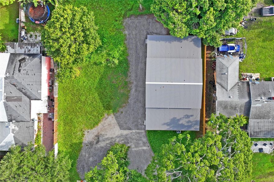 Owner financing available with 30% down and 5K per month payment. Discover a unique living solution in Sarasota with this versatile, newly constructed steel barndominium, brilliantly designed for durability, energy efficiency, and multiple income streams. Embrace a layout that not only supports a bustling family life but also offers fantastic potential for rental income or a home-based business, especially suitable for boat or RV storage.

This robust property features two distinct units: a larger unit boasting three spacious bedrooms, including a luxurious primary bedroom, two full baths, a state-of-the-art kitchen with all-wood cabinets, soft-close drawers, a large kitchen sink, neutral tile backsplash, a rolling center island, top-of-the-line stainless steel appliances, and stunning quartz countertops. The sunlit open living space and vaulted ceilings in upstairs bedrooms create an airy, loft-like ambiance.

The second unit is equally impressive, comprising two bedrooms, one full bath, a kitchenette, and a dining area — perfect for guests, renters, or extended family. Both units are equipped with energy-saving features such as LED lighting, luxury vinyl plank flooring, and high-efficiency spray foam insulation, ensuring low energy bills.

The safety and security are paramount with a construction designed to withstand winds up to 180 miles per hour, featuring impact windows and doors. The exterior is just as functional with a teeming three-car garage, equipped with roll-up doors and a soaring 21-foot ceiling — a dream for enthusiasts and hobbyists.

Ample parking space and the absence of a Homeowners Association make it easy to store large vehicles and pursue ventures without restrictions. The strategic layout includes private entrances, a dual-purpose dining room with a divider curtain, and options for an additional bedroom, ensuring this home adapts to your needs.

Located just a short drive from the heart of downtown Sarasota and near Lime Lake Park for serene walks and family outings, you're never far from urban conveniences or peaceful retreats. Easy access to major routes makes commutes a breeze, whether heading to the bustling arts scene in downtown or the pristine beaches of St. Armand and Ana Marie Island.

This barndominium is more than just a place to live; it's a lifestyle choice for those looking to combine modern urban living with practical solutions for income generation and space flexibility. Come see why the barndominium trend is soaring and consider making this innovative, low-maintenance property your new home or business headquarters.   Double lot sale! You may build a triplex next to the main home.