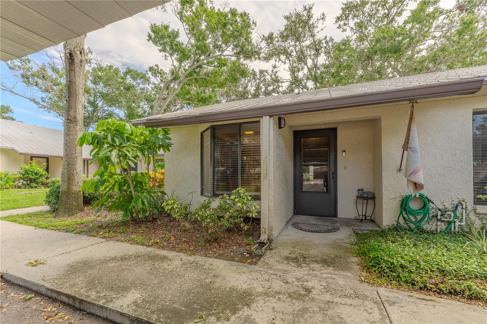 Welcome to Casa Bello, a premier 55+ community! This charming 2-bedroom, 2-bath villa-style condo offers 1,075 sq. ft. of comfortable living in the heart of Largo. The home features a spacious living and dining area, a light and bright kitchen, and a large primary suite with walk-in closet and private bath. Enjoy a Florida room with enclosed porch that extends your living space year-round. Located just minutes from parks, shopping, dining, and the Gulf beaches, this condo combines convenience with Florida lifestyle living. Perfect for full-time residence or seasonal retreat.