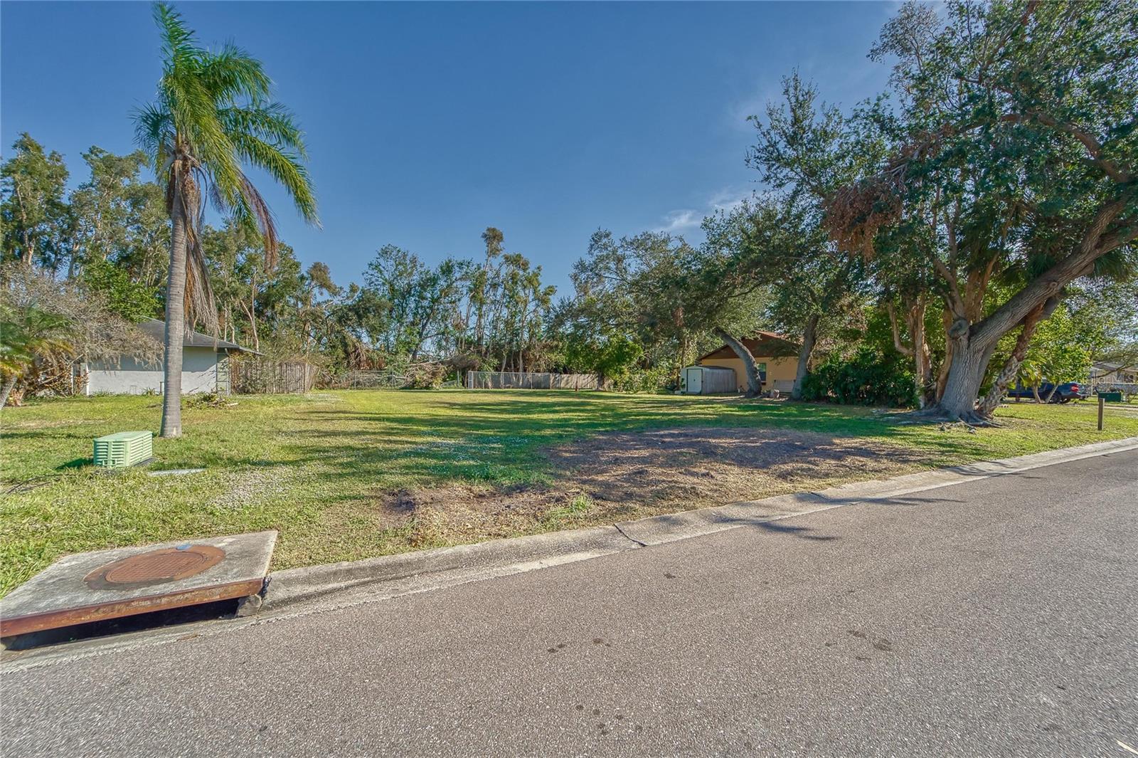 ATTENTION BUYERS & INVESTORS! Prime Residential Lot for Sale in Sarasota – Perfect Location, Excellent Opportunity! This cleared, quarter-acre lot in Sarasota is a rare find! Nestled in a peaceful neighborhood surrounded by beautiful single-family homes, this property offers the ideal canvas to build your dream home. With a few mature trees providing natural shade, you'll enjoy the perfect balance of sunny Florida living and cool, shaded spots for relaxation. Located just 2 miles from the ocean, this lot offers quick access to pristine beaches, and you're only moments away from the stunning Longboat Key – a sought-after destination for its gorgeous coastline and relaxed lifestyle. This residential lot combines the best of both worlds: proximity to serene beach life and easy access to local amenities. Don’t miss the chance to own a piece of paradise in one of Florida’s most desirable areas. Whether you’re ready to build now or plan for the future, this lot offers endless possibilities. Seize the opportunity today and make this tranquil, centrally located property yours!