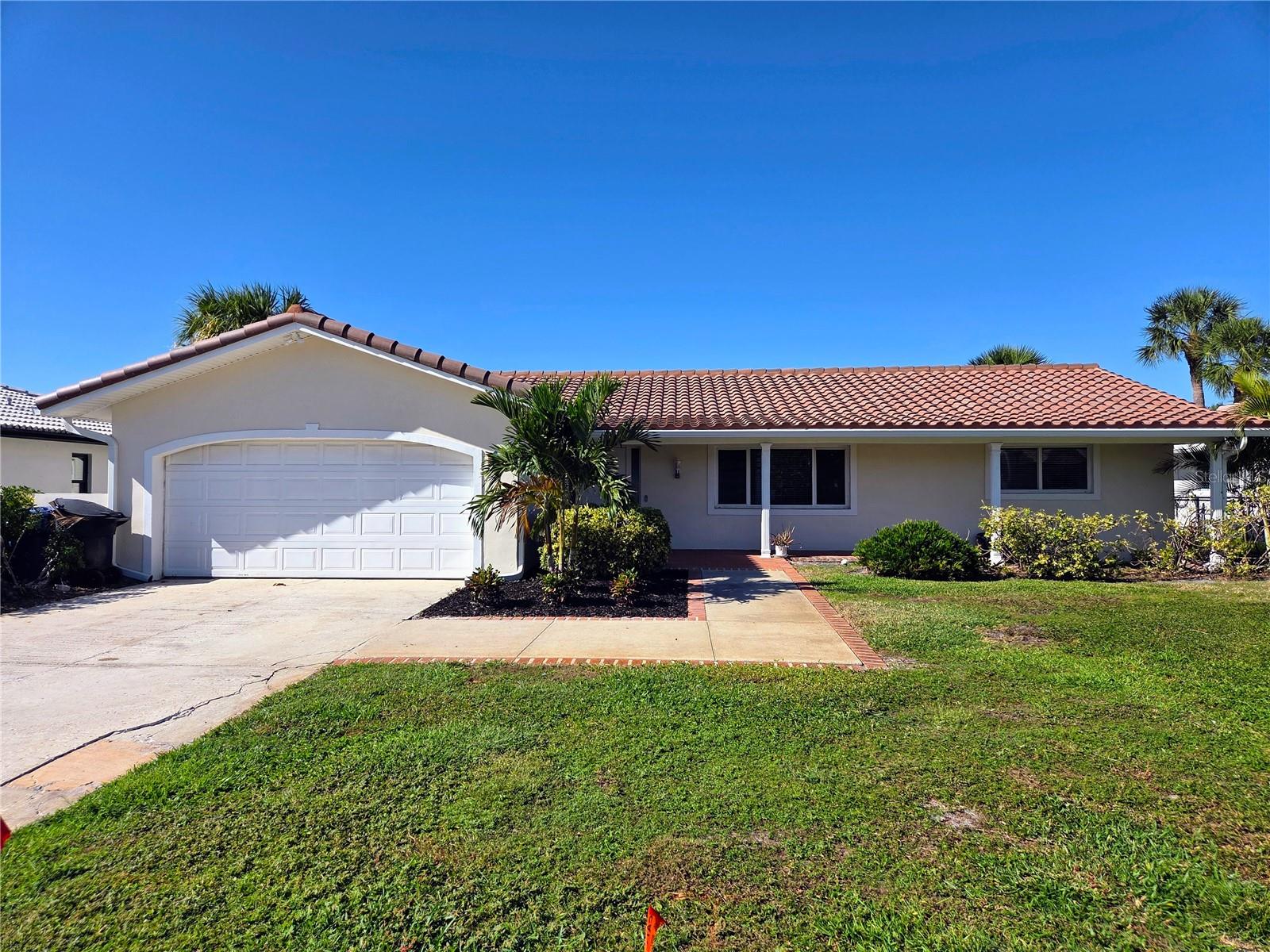 Beautiful Waterfront POOL HOME in popular Venetian Isles available for Annual Lease. This spacious home is located directly on a wide saltwater canal with no bridges out to the open water. The home has been totally renovated with new interior, luxury vinyl flooring throughout, interior paint and new fixtures. The large Living space and open floorplan is welcoming and bright with views of the waterfront and pool throughout most of the rooms. Enjoy the handsome brand new Kitchen open to the Family Room with all new white shaker style cabinets, stone countertops and new stainless steel appliances. The home features a split bedroom plan with four bedrooms and two baths with new fixtures and bath vanities. There is a Laundry room with washer and dryer for your convenience. Step outside to a tropical paradise with inground pool, heated spa, beautiful open patio and beyond to the wide open saltwater canal and dock for your boat and water toys. Application fee $65 each adult, tenant processing $100. Renters to pay $45 month for insurance and benefits package. One month security deposit. Pets up to 45 lbs OK.