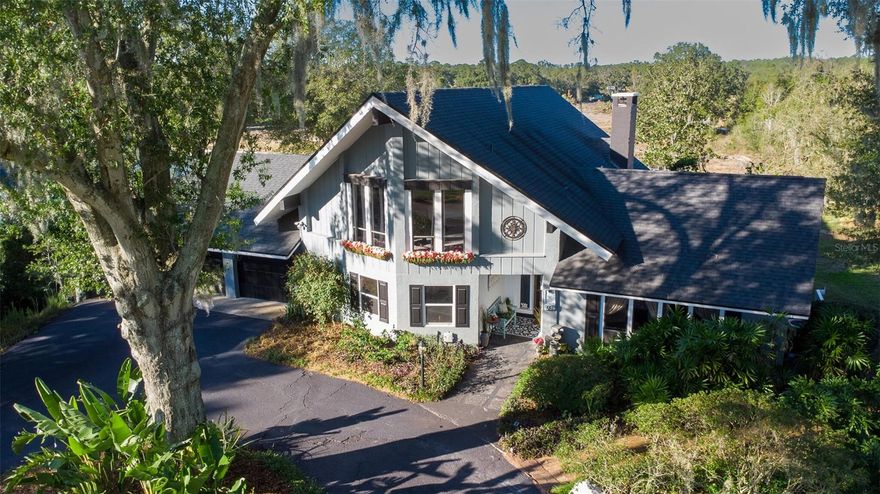 4-Bedroom or 3B with LARGE Den with movie projector and large screen, 2-Bathroom – Fully Renovated Pool Home on 0.4 Acres in a Golf Cart community. Check out the video tour!
First entrance showcases a LARGE WALL of windows with the sky's breathtaking views, and the Full Master Suite on its own floor has a retreat feel!
Discover your dream home in a peaceful, secluded neighborhood with no through traffic — where modern upgrades meet timeless charm. This beautifully renovated property has been fully updated throughout over the last six years, offering luxury, comfort, and convenience in one stunning package.
Seller providing a 1-year Home Warranty 
Key Features:
- Complete Renovation – New Roof, 2 New A/C units, New Kitchen, New Bathrooms, New Deck, New flooring, Newly painted & so much more!
- Private backyard with mature oaks & wooded views and a New Shed for extras
- Vaulted master suite with skylight, spa-like bath, soaking tub & dual showerheads
- 20+ ft ceilings with wood beam accents & a wall of windows
- Custom kitchen with pecan wood breakfast bar, reverse osmosis water purifier, and all appliances, even an 84" TV included!
- Part of the renovated garage now has a large room with a wall of mirrors and a heavy-duty mat floor ready for a home gym *(not included in Sqft of home)
- Cozy updated fireplace & jumbo ceiling fan centerpiece the living area
- Ring security system with cameras that view all around the outside of the house
- New back deck with pavers & rustic wood accents, all tied in with large railroad ties that make a statement overlooking the pool deck and firepit
Lifestyle & Location:
- Silver Lake is at the top of the street, a great place to walk, bike ride, or bird watch
- Sumter College is a bike ride away
- Close to many restaurants, shopping centers, and the Lake Square Mall
- In the heart of the world-famous Chain of Lakes — home to Bassmaster competitions! Need a boat? Ask the seller about their 2021 Pontoon for sale!
- Only 20 minutes to The Villages (world-renowned retiree capital) or historic Mount Dora known for its quaint shops and antiques.
Don’t wait — homes like this don’t come along often. Step into the FLORIDA lifestyle you deserve. Appraisal Completed Nov 2025.