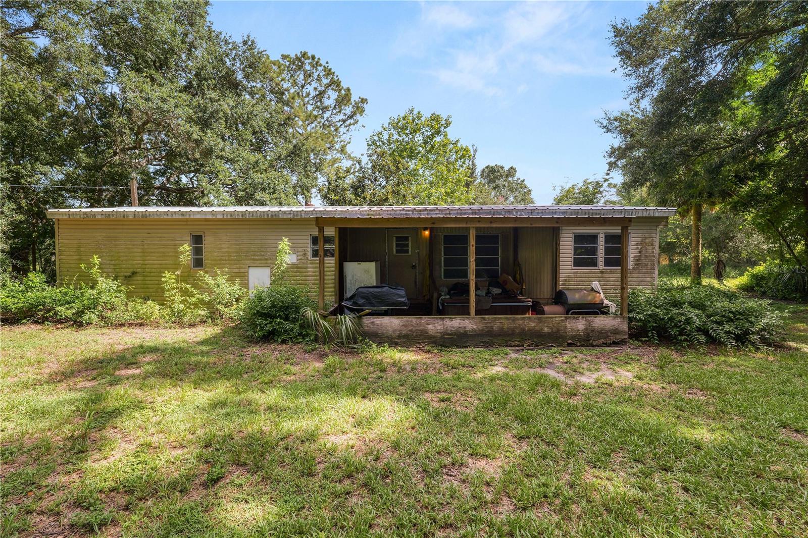 Looking for country living? Take a look at this property sitting on over 3 acres in Ft. Meade. Mobile home is either a tear down or fixer upper. Property being sold for land value only. You'll find a barn and workshop on the property as well as 2 metal carports. Don't wait to make this property your own! Schedule your private showing today!