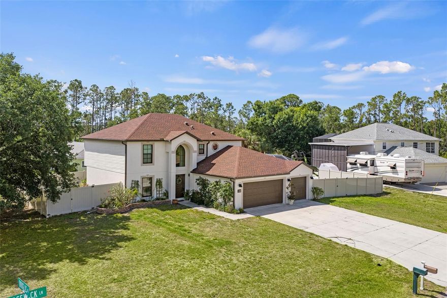 Welcome home to the perfect start of your next chapter! This beautifully maintained 4-bedroom, 2.5-bath home offers the ideal combination of space, comfort, and value for first-time home buyers looking to settle into a home that truly has it all. Nestled on a quiet corner lot surrounded by mature trees, this move-in ready gem welcomes you with charming curb appeal, a lush green lawn, and an elegant arched entryway that immediately feels warm and inviting. Enjoy added peace of mind with a roof and AC system installed in 2022, along with brand-new impact windows added in 2024. Inside, you’ll love the bright and spacious open-concept floor plan designed for both everyday living and entertaining. Rich hardwood-style flooring flows throughout the main living areas, while the generously sized kitchen serves as the heart of the home with stainless steel appliances, abundant cabinetry, a unique reclaimed wood center island, and a sunny eat-in dining area with French doors leading to the backyard. The arched pass through openings create a seamless connection to the cozy living room, making gatherings with family and friends feel effortless. Need extra space? The versatile bonus great room offers endless possibilities whether you dream of a home office, playroom, fitness area, media room, or cozy den. An inside laundry room adds convenience and functionality to daily life.
Upstairs, the spacious primary suite provides a relaxing retreat complete with a walk-in closet, dual sink vanity, and beautiful architectural arch details that add character and charm. Three additional bedrooms offer flexibility for guests, family, hobbies, or future growth.
Step outside and enjoy your own private Florida oasis featuring a screened-in saltwater pool, tropical landscaping, a fenced backyard, and a fire pit patio perfect for relaxing evenings under the stars. With a three-car garage, vinyl privacy fencing, and thoughtful details throughout, this home checks every box for buyers ready to stop renting and start building memories.
Don’t miss this incredible opportunity to own a home that combines style, functionality, and room to grow all in one beautiful package!