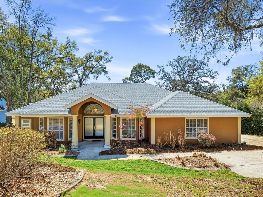 Gorgeous four bedroom three bath custom pool home overlooking serene Lake Francis. The home sits high above the lake allowing for picture perfect views and a large yard all sitting on nearly half an acre. Large primary bedroom with a walk in closet, and spa like bathroom complete with separate shower and tub that overlooks the lake. Split bedroom floor plan allows for privacy and functionality. The screened patio offers outdoor kitchen facilities and a heated pool. Entire home was re-piped in 2025, whole home water filtration system, roof 2018, two zoned AC's one is 2023 2nd is 2019, water heater 2025. Launch a small boat right from your yard and enjoy some of the best fishing in the area on the lake fully stocked with large mouth bass. True relaxation on a beautiful setting home to a variety of birds including eagles, sandhill cranes, owls, ospreys, herons, and ducks.  Excellent location just minutes to 429 and 441.