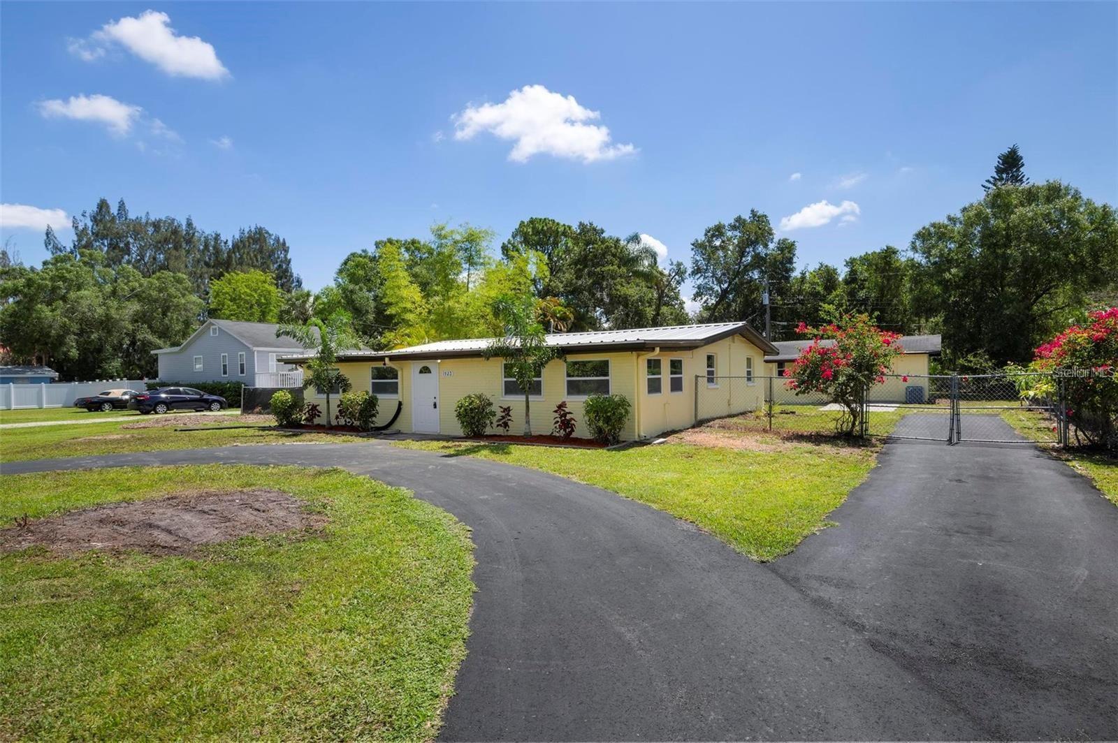 Incredible Investment Opportunity or Multi-Generational Living – Two Homes on One Property! Welcome to 1923 45th Street Court E – a truly rare find in Bradenton! This beautifully remodeled property features TWO separate homes, offering ultimate flexibility and value with no deed restrictions, HOA, or CDD fees. The main home is a stunning 4-bedroom, 2-bathroom residence that has been completely remodeled down to the studs. Everything is brand new, including electrical, HVAC, windows, flooring, kitchen, and bathrooms – offering peace of mind and modern comfort throughout. Out back, you'll find a charming 2-bedroom, 1-bathroom guest house, perfect for rental income, a home office, or extended family. Each home has its own private entrance, making it ideal for multi-generational living or house hacking. Tucked away on a quiet street, yet minutes from downtown Bradenton, shopping, schools, and I-75, this unique property offers unbeatable versatility and value. Don’t miss out on this amazing opportunity – whether you're an investor or looking for the perfect space for two families, this property checks all the boxes!