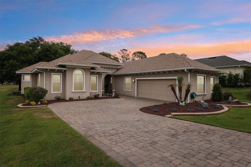 Price Improved! Seller pays Initiation Fee of $2,500 at Closing! Move-In ready 4BR/3BA, 2,900 SF golf and pond front home in Harbor Hills near The Villages, FL. NO Bond or CDD. This is a Parade of Homes winning model home is a meticulously maintained single-story residence 
offering tranquil golf course and pond views within a 24-hour guard-gated multigenerational community. It is priced to sell alongside homes built a decade or more earlier, creating a clear newer-construction advantage. Constructed in 2019 with modern systems designed for improved energy performance and cost efficiency compared to older homes, the property combines block construction and a split-bedroom layout that supports long-term durability and functional flexibility while maintaining an open design suited for everyday living and entertaining. Interior features include coffered and tray ceilings, stacked crown molding, plantation shutters, 8-foot interior doors, and upgraded finishes throughout. The kitchen features quartz countertops, a generous center island, walk-in pantry, induction range, stainless steel appliances, oversized appliance storage, and custom dry bar cabinetry. The primary suite includes dual walk-in closets with built-ins and an ensuite bath with a soaking tub, oversized walk-in shower, dual vanities, and a Toto Washjet water closet. Two additional bedrooms offer walk-in closets and share a full bath, while the fourth bedroom with custom built-ins functions seamlessly as an office or guest suite with adjacent full bath access. A glass-enclosed lanai adds approximately 400 square feet of climate-controlled living space supported by a Mitsubishi mini-split system and positioned to capture sweeping golf and pond views. The panoramic screened paver birdcage extends outdoor enjoyment and the 0.34-acre lot allows room for a future pool, subject to HOA approval. The 2.5-car side-entry garage includes Trac flooring, golf cart parking, and a power attic lift. Septic has been recently pumped and the roof soft washed, reflecting careful ownership and true move-in readiness. HOA is $182 per month and includes 24-hour guard service and private roads. A required Social Membership is $230 per month providing access to the clubhouse, resort-style pool, fitness center, tennis, pickleball, dining, and community events, with optional golf and marina access available separately. UF Health The Villages Hospital is less than 15 minutes away. The Villages community offering live nightly entertainment is approximately 15 minutes away. Orlando International Airport and Walt Disney World are just over one hour away, and the World Equestrian Center in Ocala is under one hour, providing regional accessibility while maintaining a private residential setting and refined Florida living.