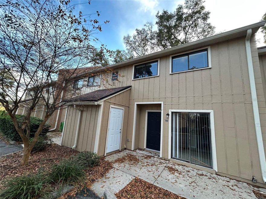 Newly renovated 3br/2.5ba condo with washer/dryer hook ups. Sliding glass door from the kitchen leads to front patio with outside storage. Separate dining room with huge living room with another set of sliding glass doors leading to the rear patio. Half bath downstairs for guest and a full laundry room. Upstairs the master bedroom has a walk in closet and its own balcony to enjoy the evenings on. New carpet and tile for the flooring. New paint and updated kitchen and bathrooms. The community offers a clubhouse with fitness equipment, parking, pool, and tennis courts. Great location to UF, North Florida Hospital, I-75, and restaurants and shopping.