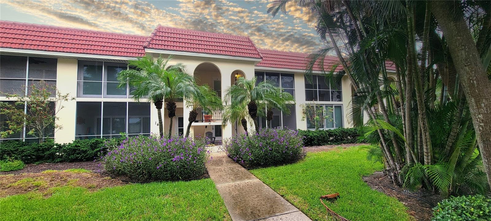 The absolute best of both worlds! About a 2/3 mile walk to the gulf beach access and about 100 feet to the Siesta Key Village! This second-floor condo was completely renovated in 2020. The owners created a stunning home away from home that features a relaxing front sliding glass-enclosed patio that can be opened to enjoy the gentle gulf breezes. The opened kitchen has lightly veined white quartz countertops (bathrooms, too), a huge gathering island, custom solid wood cabinetry and striking blue ocean backsplash! The bathrooms are just as beautiful and are completely redone with locally crafted custom vanities. Additional features include custom shiplap walls in the bathrooms, porcelain tile flooring throughout, new lighting switches and receptacles, impact-glass windows and sliders, new, new, new! The decorations and furnishings are to owners' standards- not renters. The spacious master bedroom has a 2-year-old King Sleep-Number bed, with a beautifully tiled ensuite bath. The second bedroom has a custom Queen Murphy bed. There is a hall laundry closet with newer washer/dryer stack unit and newer water heater. A brand-new Gordon HVAC was installed with a 10-year warranty and there is a brand-new roof as well. Private storage is stocked with beach toys! Enjoy a two-minute walk to the SK Village with several restaurant choices, shopping, nightlife, ice cream, and grocery store and only a 4-minute walk to the white quartz sandy beach! Truly one of the best locations on the key!