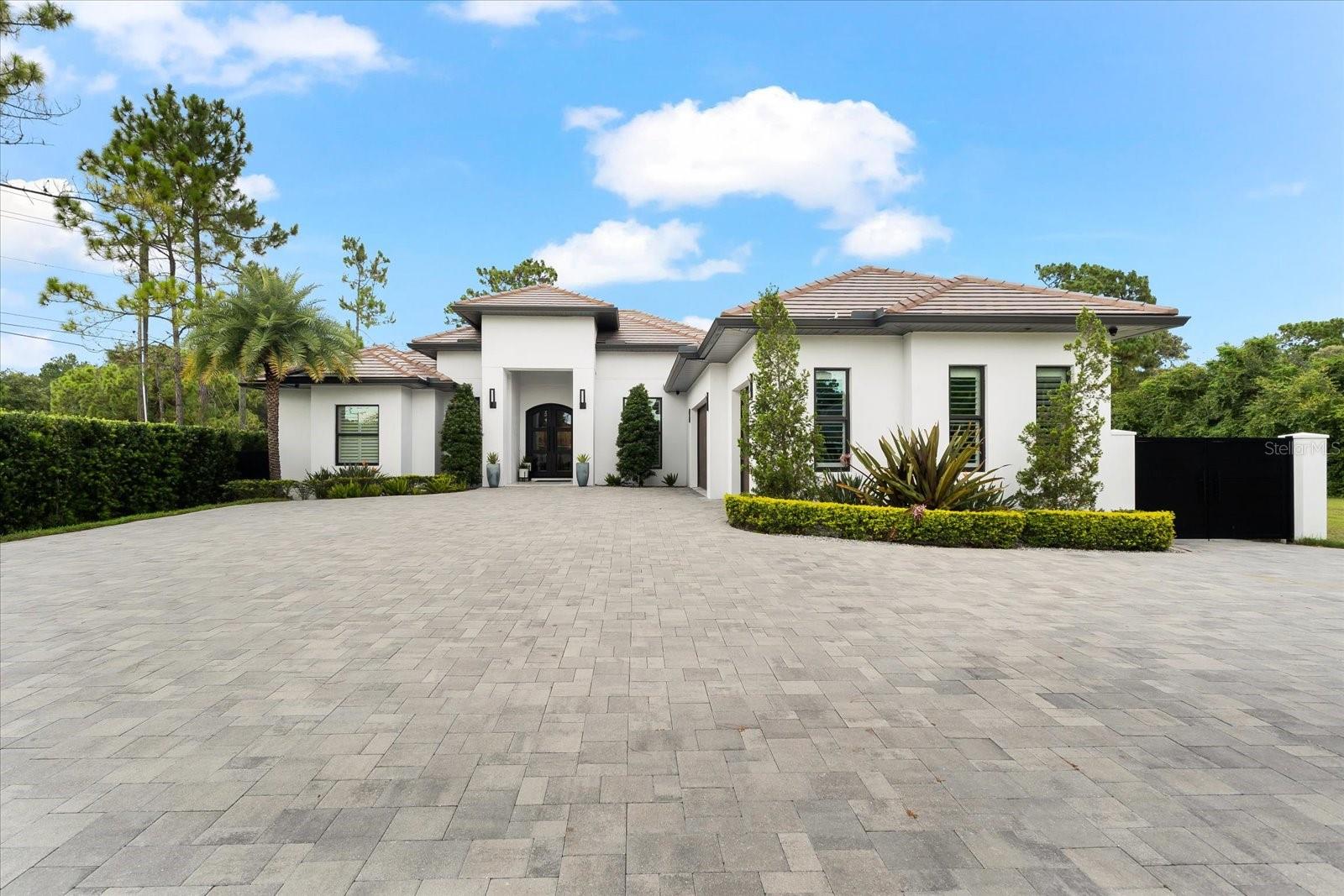 "The house is back on the market due to buyer's contingency not being fulfilled." Welcome to this beautiful luxury home that blends elegance and a cozy atmosphere at every corner. Step inside and be greeted by the grand foyer, adorned with a stunning chandelier and polished porcelain tile floors, setting the tone for the opulence that awaits. The spacious and custom-designed kitchen is a true chef's dream, featuring top-of-the-line appliances, quartz countertops, and custom-made cabinets that add a touch of personalized charm. Whether you're hosting a dinner party or enjoying a quiet breakfast with family, this kitchen is sure to delight even the most discerning culinary enthusiasts. The main house features 3 bedrooms and 3 bathrooms, providing ample space and comfort. Additionally, the detached guest house offers 1 bedroom, 1 bathroom, and a fully equipped kitchen. Complete with its own electrical and water meter, it provides the perfect retreat with all the comforts and amenities one could desire, making it perfect for visitors or extended family stays. In total, the property boasts 4 bedrooms and 4 bathrooms. Located in close proximity to the Veterans Expressway, this stunning residence offers convenience and easy access to major thoroughfares for effortless commuting. This property seamlessly combines luxury living with practicality. Experience the epitome of luxury living in this exceptional residence, where impeccable craftsmanship meets modern convenience. The attention to detail, the high-end finishes, and the impeccable design make this home a true masterpiece. Come and experience the epitome of luxury living. Your dream home awaits!