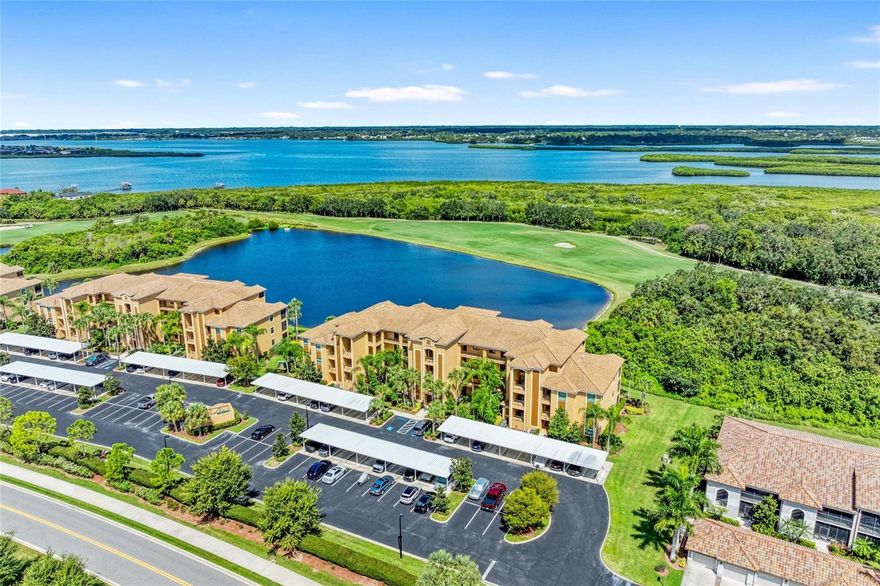 Discover elevated resort-style living in this beautifully appointed 4th-floor residence in the highly sought-after community of River Strand Golf & Country Club. This model offers breathtaking panoramic golf course and lake views from the comfort of your private screened lanai, delivering true PENTHOUSE-STYLE living in one of the area’s premier gated communities.

This spacious 2-bedroom, 2-bath condominium is offered with immediate closing available and includes a full Golf & Country Club membership, granting access to the renowned 27-hole Championship Golf Course. Thoughtfully upgraded throughout, the residence showcases elegant, tile and carpet flooring throughout the main living spaces, granite countertops, solid wood cabinetry, stainless steel appliances, and a system for peace of mind.

The open-concept floor plan features a charming breakfast nook overlooking the water, a formal dining area ideal for entertaining, and abundant natural light that enhances the spectacular scenery from nearly every room.  The washer and dryer are also included for convenience.

Additional highlights include a private storage closet  — perfect for golf clubs, bicycles, beach gear, and seasonal items — along with a dedicated covered carport and plentiful guest parking. This elevator building is ideally positioned just steps from one of the community’s satellite pools.

River Strand at Heritage Harbour offers an unparalleled lifestyle with maintenance-free living and world-class amenities. Residents enjoy access to two Tuscan-inspired clubhouses, including an impressive 39,000-square-foot NEWLY RENOVATED  main clubhouse featuring two exceptional restaurants, a state-of-the-art fitness center, resort-style pools with TERRACE BAR  service, eight tennis courts, and eight highly popular pickleball courts. Additional amenities include billiards, social rooms, conference space, and an active year-round social calendar.

Golf membership is transferable to tenants, making this an outstanding investment opportunity as well. The community is secured with 24-hour manned gated security and is ideally located just off I-75, providing convenient access to upscale shopping, fine dining, University Town Center, downtown Sarasota, and the world-renowned beaches of Siesta Key and Anna Maria Island.

HOA fees include WiFi, basic cable, water, sewer, and trash service. A $750 annual restaurant allowance is included, along with a one-time $610 amenity transfer fee.

The property is currently leased to an excellent tenant through November 30, 2026, offering immediate rental income potential.