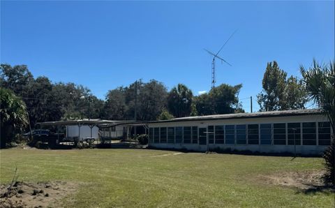 Photo of 13046 SE 102nd Terrace, Ocklawaha, FL 32179 (MLS # OM710357)