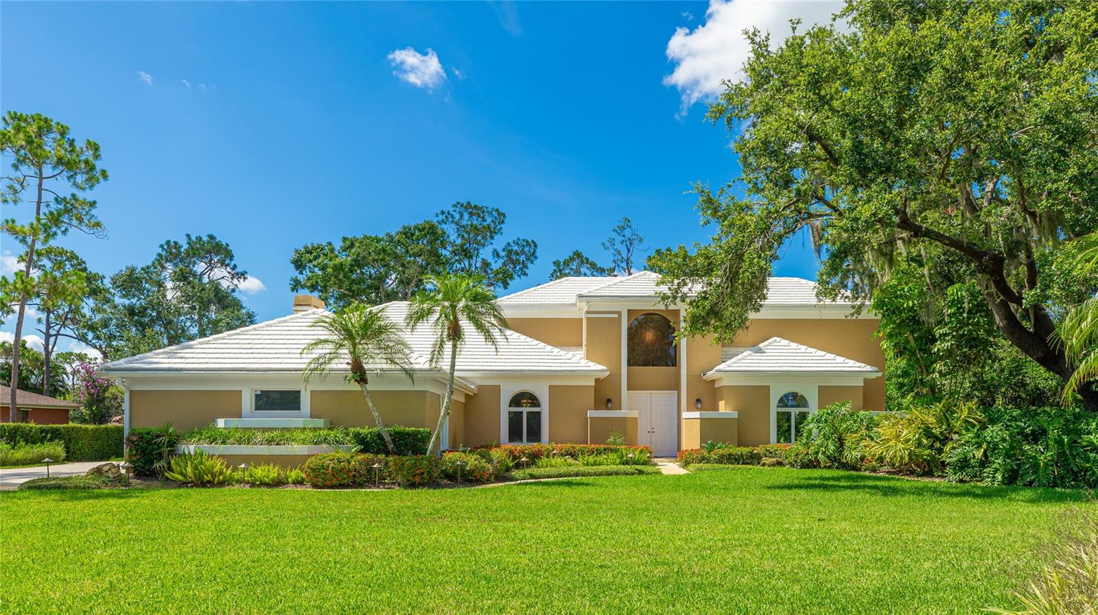 Welcome to your dream home in the highly sought-after community of Woodlands II at Bent Tree. Perfectly situated on over half an acre of lush, lakefront property, this 5-bedroom, 3-bathroom pool home offers an ideal combination of space, comfort, and natural beauty.
Tucked away on a quiet street lined with mature trees, this residence offers both privacy and tranquility. Set within a community known for its architecturally unique homes, each residence in Bent Tree showcases its own distinct character—no cookie-cutter designs here.
Inside, the well-designed floor plan features a spacious first-floor primary suite with dual walk-in closets, French doors to the lanai, and a spa-inspired bathroom complete with new dual vanities, a soaking tub, and a walk-in shower.
The heart of the home is the open-concept kitchen, thoughtfully updated with granite countertops, stainless steel appliances, and a breakfast bar overlooking the vaulted family room with a cozy wood-burning fireplace—perfect for gatherings or everyday living.
Step outside to your private backyard retreat, where a screened-in pool and spa are framed by picturesque lake views, creating a peaceful space to relax or entertain.
Additional highlights include a three-car side-entry garage with generous parking space outside, ideal for guests or extra vehicles, and a location in an A-rated school district, just minutes from Sarasota’s world-renowned beaches, shopping, dining, and recreation.
This is more than a home—it’s a lifestyle. Don’t miss the opportunity to make this exceptional lakefront property yours. Schedule your private tour today. Please be advised that some photographs have been virtually staged.