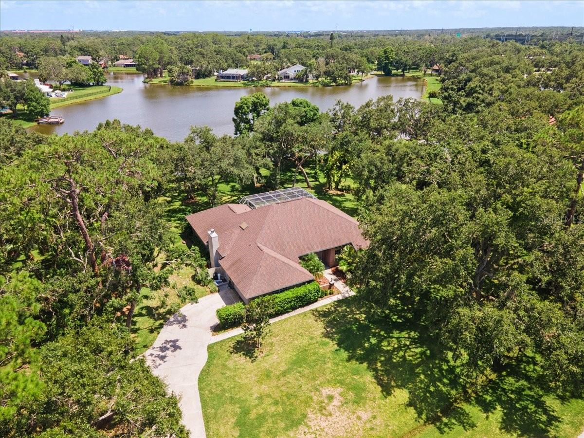 Your private sanctuary awaits nestled in the heart of the highly sought-after Braden Woods community. This beautifully updated 4-bedroom, 2-bathroom pool home is perfectly positioned on an expansive homesite with breathtaking pond views, a private dock, and lush mature landscaping that frames the property with peace and privacy.
From the moment you arrive, you're greeted by the charm of towering oak trees and a welcoming front elevation that hints at the serenity inside. Step through the double-door entry to discover an open, light-filled floor plan designed for both relaxed living and elegant entertaining. The spacious living and dining areas feature vaulted ceilings, updated flooring in bedrooms, and panoramic views of pool and tranquil water beyond.
The thoughtfully designed kitchen offers abundant cabinetry, granite countertops, updated appliances, and a cozy breakfast nook overlooking the lanai. The split floor plan provides maximum privacy, with the primary suite offering tranquil pond views, direct pool access, a generous walk-in closet, and a updated ensuite bath with a walk-in shower and dual vanities.
Step outside to your private outdoor oasis, complete with a screened-in pool, large covered lanai, and your very own dock on the pond—perfect for launching a kayak or soaking in nature’s beauty. This peaceful backyard is a dream setting for morning coffee, weekend BBQs, or evening sunsets by the water.
Additional highlights include a two-car garage, laundry room with storage, and plenty of room for hobbies, pets, or play.
Braden Woods is known for its large lots, low HOA fees, and natural Florida setting, all while being minutes from Lakewood Ranch, I-75, top-rated schools, shopping, dining, and the Gulf beaches.
This is more than just a home—it’s a lifestyle. Schedule your private showing today and experience the perfect blend of comfort, nature, and location.