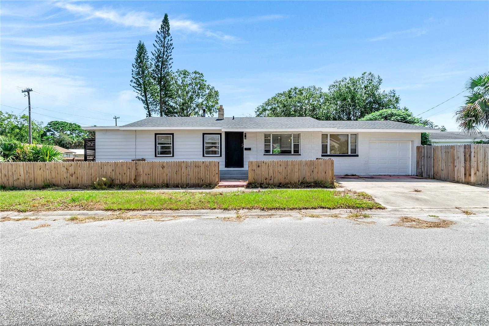 UPDATED 2 bedroom/2 bathroom home just under a mile from the beautiful Indian River and with NO HOA! This home is packed with modern upgrades including updated light fixtures and fans, newer flooring through out. Both bathrooms have been fully updated with new vanities, new tile, new fixtures and new toilets . Completely renovated kitchen featuring GRANITE countertops, stainless steel dishwasher, stylish TILE backsplash, and new cabinetry. The home stays cool year-round with FOUR energy-efficient mini split systems. Additional highlights include a NEW electrical panel, NEW ROOF, an OVERSIZED garage, and a FULLY FENCED BACKYARD with added deck. You won't want to miss this one, schedule your private showing today!