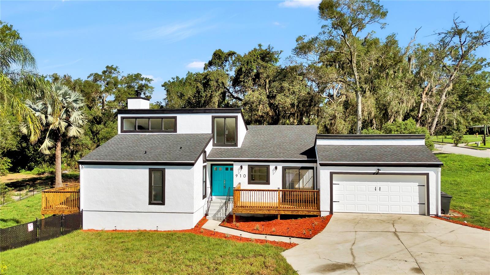 Welcome to your lakeside sanctuary at 910 Florida Boulevard — a fully remodeled home where modern design blends seamlessly with the natural beauty that surrounds it. With a new roof, new AC, and brand-new flooring, this property offers the perfect combination of comfort, style, and tranquility. From the moment you walk in, you will be captivated by high ceilings and expansive windows that fill the home with natural light and frame breathtaking views of Lake Florida and lush conservation areas. The living room is both warm and inviting, featuring a beautiful fireplace that adds character and charm to the space. The spacious kitchen was designed with functionality in mind, offering plenty of room for cooking, storage, and a cozy breakfast area — perfect for everyday living and casual dining with a view. Modern and thoughtfully renovated, the bathrooms combine clean lines with practical design, providing fresh, comfortable spaces to start and end your day. The master suite feels like a retreat, complete with its own private deck that overlooks the serene conservation area — an ideal spot to enjoy your morning coffee or unwind as the sun sets. Whether you're looking for your forever home or a place to reconnect with nature, this one-of-a-kind property invites you to live with intention, surrounded by light, nature and a deep sense of calm.