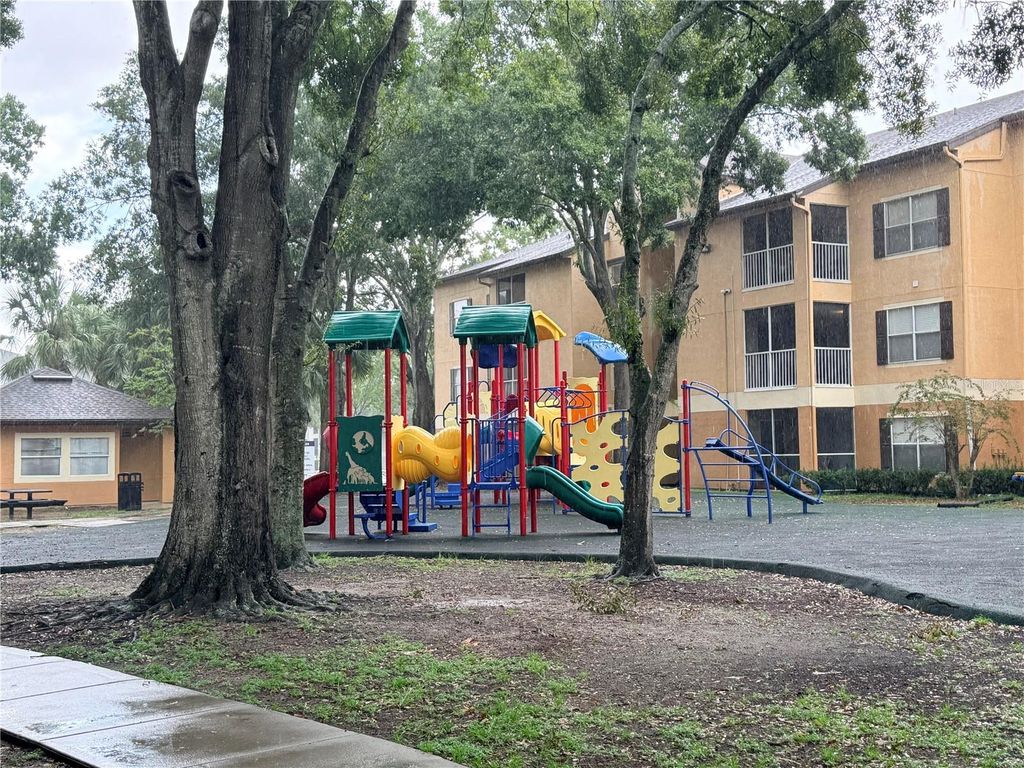 Photo of 7606 Pissarro Drive #105, Orlando, FL 32819 (MLS # S5135838)