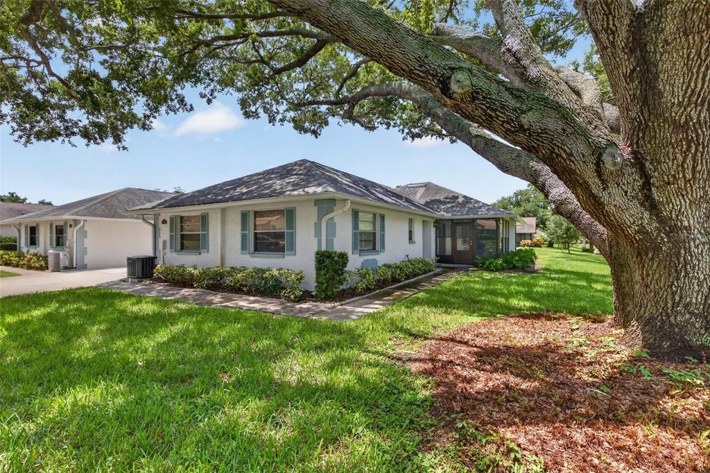 Photo of 1275 Stonehaven Lane, Dunedin, FL 34698 (MLS # TB8535584)