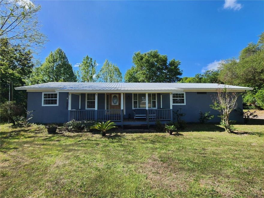 Experience the freedom of country living with the convenience of nearby amenities on this beautiful 5-acre property. This versatile offering includes two parcels sold together, featuring a 4-bedroom, 2-bath home with a sparkling pool and plenty of room to make the space your own.

The home provides a comfortable layout with natural light and peaceful views of the surrounding acreage. Step outside to the pool area—perfect for relaxing, entertaining, or enjoying Florida’s sunshine year-round.

Property highlights include two large outbuildings ideal for storage, workshops, equipment, or hobbies, along with a carport for additional covered parking. With open land, mature trees, and no HOA, this property offers endless possibilities—bring your animals, toys, or vision for a private homestead.

A rare opportunity to own usable acreage with valuable improvements already in place, all just a short drive from downtown Eustis, Mount Dora, and local conveniences.