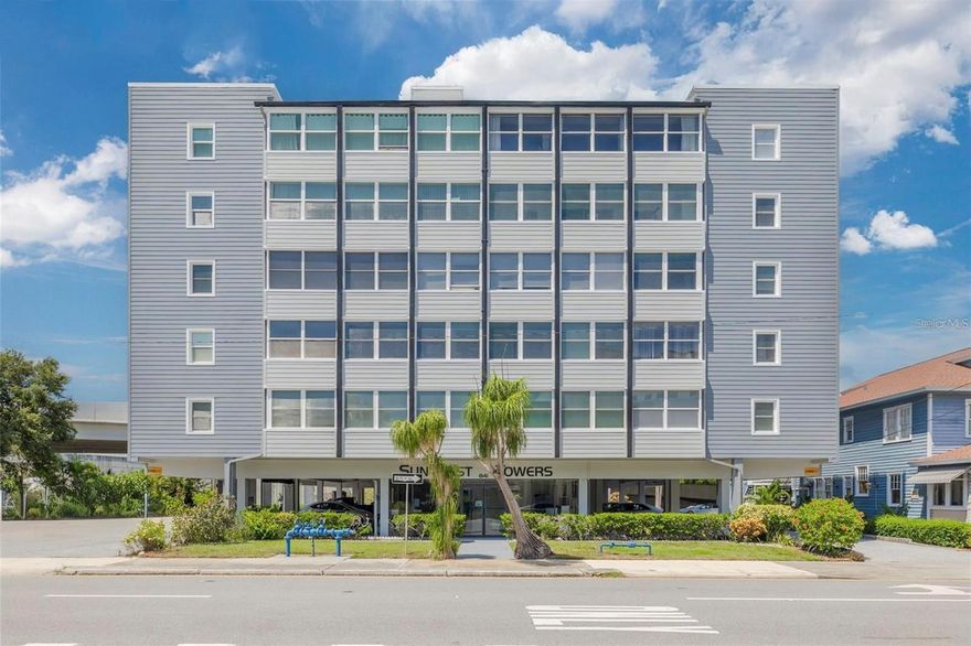 This exquisite fifth-floor corner unit at Suncoast Towers, a 55+ co-op community in the heart of downtown St. Petersburg, offers the perfect blend of modern updates and convenient urban living. Pay just one low monthly association fee to include water, power, insurance, internet, basic cable, sewer/trash, and more. Step inside to an open floor plan that flows seamlessly from a spacious living room complete with laminate wood flooring, mounted flatscreen TV and optional furniture to a dedicated dining area ideal for entertaining or everyday meals. The beautifully updated kitchen is a standout, boasting custom cabinetry with soft-close doors, stainless steel appliances, cooktop stove, decorative tile backsplash, marble tile floors, a single-basin sink with integrated butcher block chopping surface, and a custom light/fan combo. It's both functional and beautiful with ample storage for all your culinary needs. The generously sized bedroom provides a peaceful retreat, while the updated bathroom impresses with subway tile walls, a tub/shower combo featuring a glass shower door, black hardware, decorative wallpaper accents, and modern finishes. Additional highlights include updated vinyl windows for energy efficiency, a digital thermostat, 5 1/4-inch baseboards, six-panel doors, recessed lighting, Roman shades, and lots of storage with a handy coat closet & linen closet. Suncoast Towers delivers a low-maintenance lifestyle with elevator access to your floor, key fob building entry, on-site laundry facility, building bike storage, community club room, grilling station, guest parking, and a covered lanai with a sitting area perfect for enjoying city views. Located steps from downtown's vibrant dining, arts, culture, parks, The Pier, and waterfront attractions. This turn-key gem combines sophistication, comfort, and prime location ideal for those seeking an unrivaled lifestyle in downtown St. Pete. Start living today!