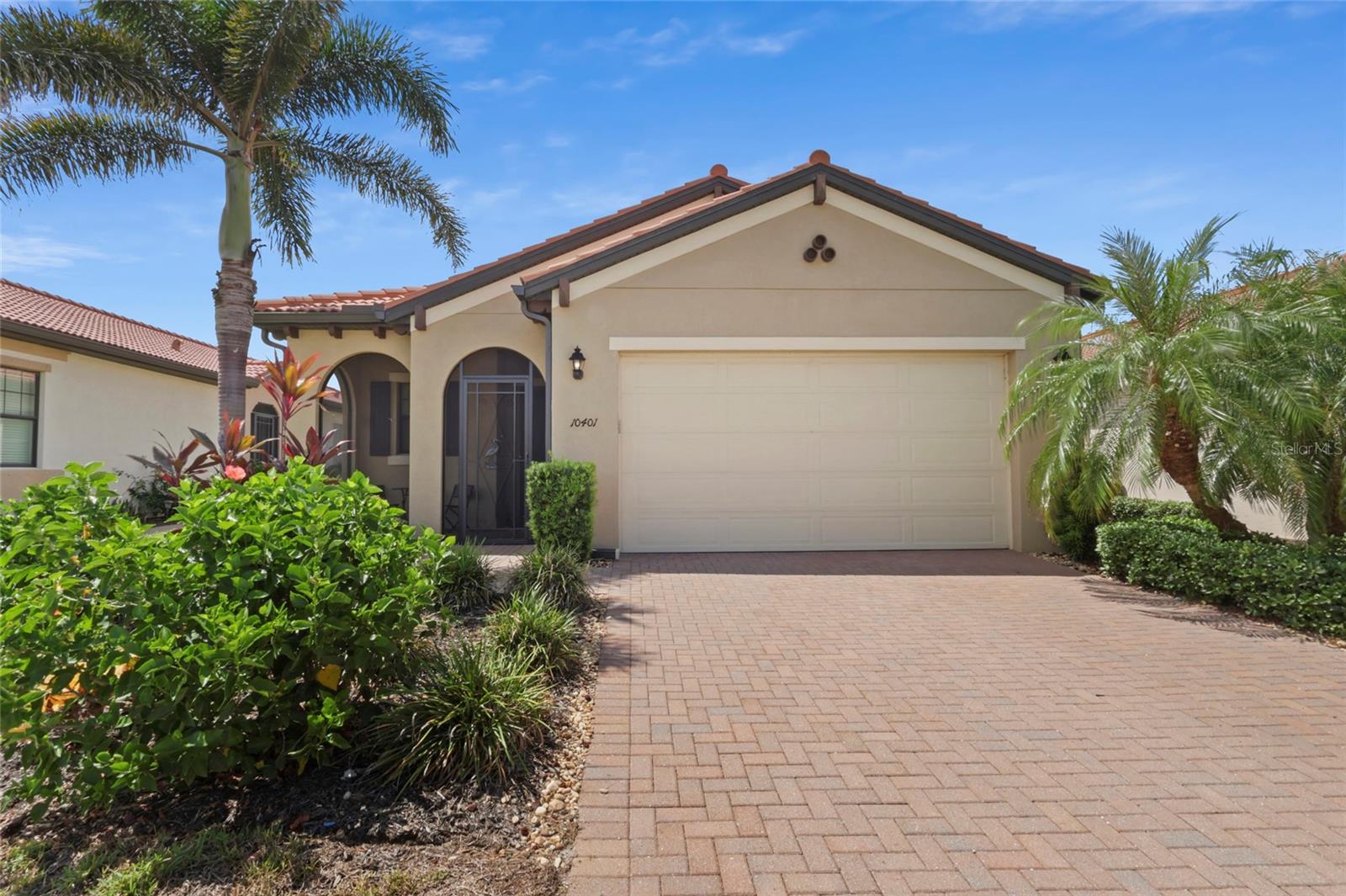 Welcome to this beautifully maintained WCI-built home in the sought-after gated community of Sarasota National. Freshly painted with an open, airy layout, this home features 10-foot ceilings, 8-foot doors, and 18” porcelain tile flooring throughout. Classic plantation shutters add a warm, finished touch to every window.
Just off the foyer is a flexible space perfect for a home office, den, or even a third bedroom for visiting guests. The kitchen is a standout with granite countertops, stainless steel appliances including a convection oven and microwave, a new stainless-steel refrigerator, soft-close drawers, a double sink, and upgraded 42" cabinets with pull-outs. A walk-in pantry adds even more storage.
The private primary suite sits at the rear of the home with two large walk-in closets and a spa-like bath featuring a frameless glass shower, dual vanities with added storage, and a separate water closet. The split floorplan offers a spacious second bedroom and full bath, ideal for guests.
Step outside through oversized pocket sliding doors to the extended screened lanai, complete with freshly sealed pavers and an outdoor kitchen—perfect for relaxing or entertaining. The tranquil backyard offers partial water views and a full preserve backdrop, providing peaceful privacy and a true Florida nature experience.
Sarasota National is a resort-style, amenity-rich community with over 2,400 acres of protected land, lakes, walking and biking trails, a championship 18-hole golf course, dog park, playground, and more. Located just minutes from Gulf beaches, Historic Downtown Venice, Wellen Park, and a variety of local shops, restaurants, and entertainment.