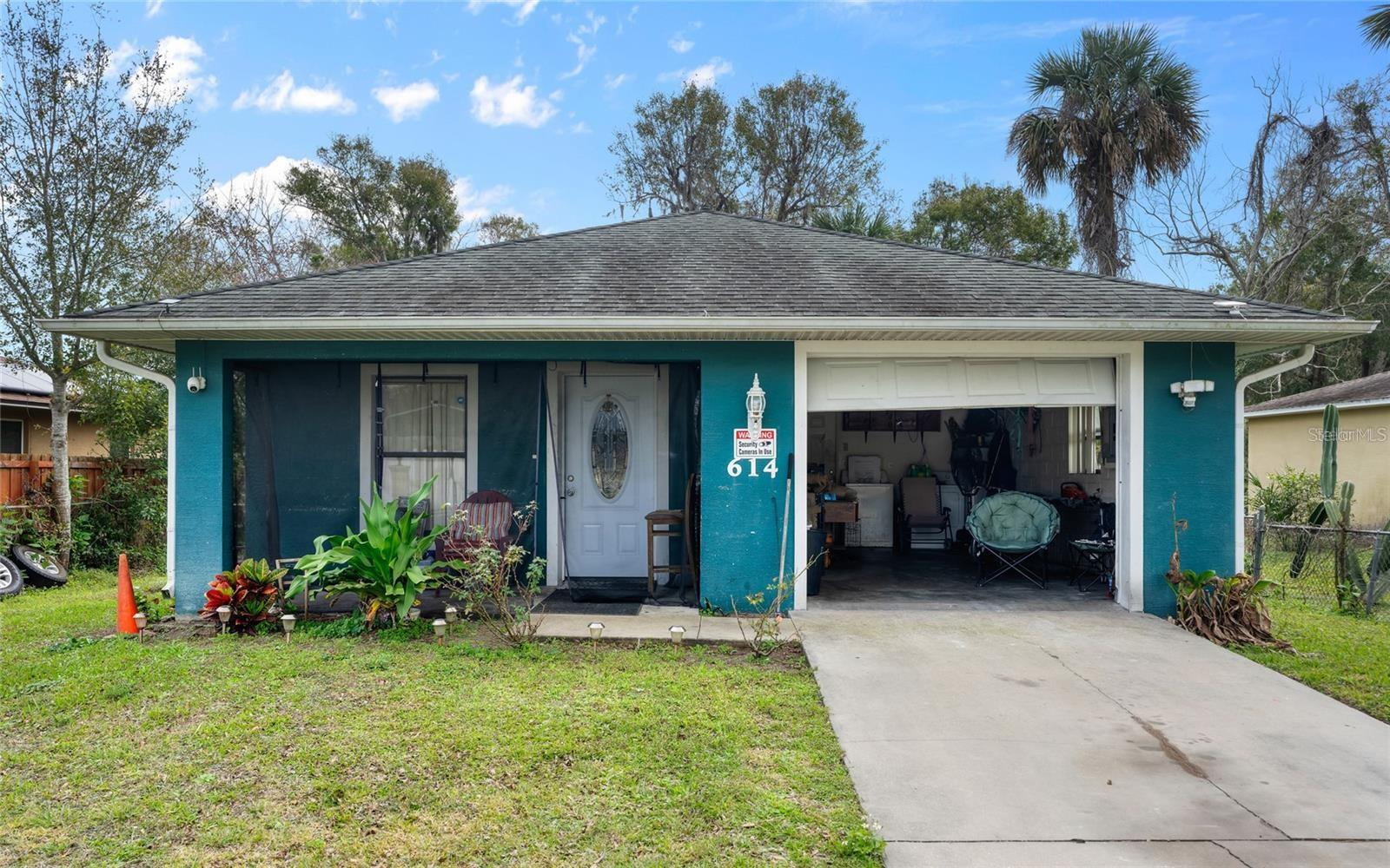 Welcome to your new haven in New Smyrna Beach, just moments from the vibrant downtown and nestled by the river. This charming two-bedroom, one-bath home boasts a sturdy concrete block construction, ensuring durability and peace of mind. Step inside, and you'll be greeted by a seamless vinyl flooring that spans the entire home, creating a cohesive and modern aesthetic. The open-concept design is accentuated by volume ceilings, enhancing the sense of space and light throughout. The living areas effortlessly flow, providing a perfect canvas for both cozy evenings and lively gatherings with friends and family. Discover the well-designed bedrooms, each offering just the right amount of space for comfort without unnecessary excess. This home strikes the perfect balance, providing an intimate and inviting atmosphere. Whether you're enjoying the private tranquility of your space or exploring the nearby downtown delights, this residence in New Smyrna Beach invites you to embrace a lifestyle where comfort, style, and convenience seamlessly converge.