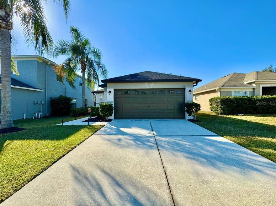 Welcome home to this beautifully updated 3-bedroom, 2-bathroom residence with a 2-car garage located in the sought-after Bridgewater community of Wesley Chapel. Step inside to find modern wood-look tile flooring throughout and a stunning modern kitchen featuring stainless steel appliances, granite countertops, and an eye-catching tile backsplash. Both bathrooms have been thoughtfully updated, and the primary suite offers an en-suite bath complete with dual sinks and a spacious walk-in shower. Enjoy Florida living year-round in the screened-in lanai overlooking the fully fenced backyard perfect for pets, play, or relaxing outdoors. A washer and dryer are conveniently located in the home for added ease. Bridgewater offers an array of amenities including a basketball court, playground, tennis court, and covered pavilions with BBQ areas. Situated in the rapidly growing Wesley Chapel area, you're just minutes from The Grove Shopping Mall, Bridgewater Community Park, and Wesley Chapel District Park, which features walking trails, a community garden, sports fields, and playgrounds. A short drive takes you to the breathtaking Epperson Lagoon, boasting seven acres of crystal-clear water and endless activities. With outlet malls, upscale dining, medical centers nearby and top-rated schools within walking distance this home offers comfort, convenience, and an incredible lifestyle. Don't miss the opportunity to make it yours! In addition to the advertised base rent, all residents are enrolled in the Resident Benefits Package (RBP) for $50.00/month which includes HVAC air filter delivery, credit building to help boost your credit score with timely rent payments, utility concierge service making utility connection a breeze during your move-in, and much more! More details upon application. One pet welcome, 25 lbs max, no aggressive breeds. Hot tub does not convey. Vacant and available now!