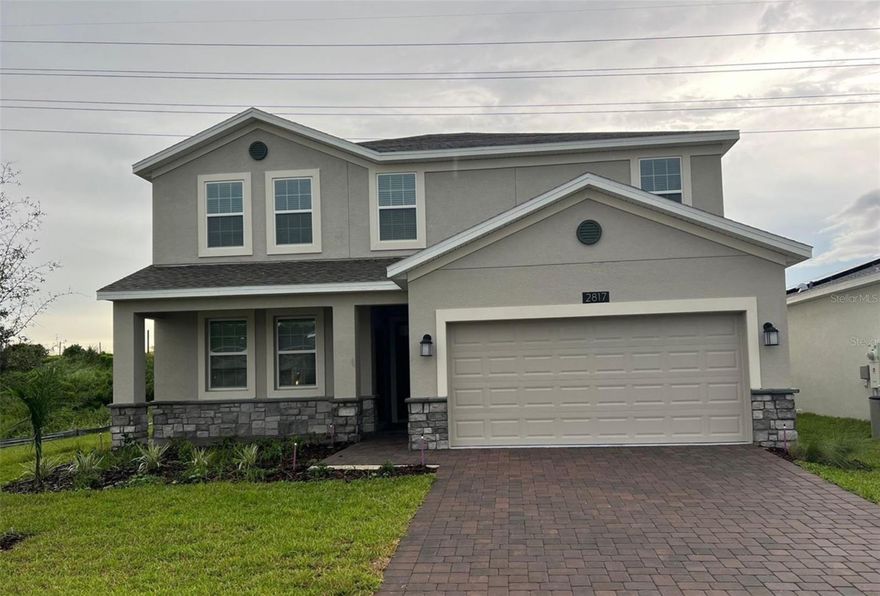 Located in the highly desirable Providence community in Davenport, Florida, this beautiful 2022-built single-family residence offers the perfect combination of modern living, space, and investment potential.
The home features 5 bedrooms and 3.5 bathrooms, including a Lennar Next Gen in-law suite with a private entrance, making it ideal for extended family, guests, a private office. 
The main residence showcases a bright open-concept layout with elegant plank flooring, quartz countertops, stainless steel appliances, and a spacious kitchen, dining, and living area designed for both comfort and entertaining. The upstairs primary suite offers a relaxing retreat with a soaking tub, separate shower, dual vanities, and a walk-in closet.
The attached Next Gen apartment provides a fully  space featuring its own bedroom, bathroom, kitchen, living area, and stackable washer and dryer, creating flexibility for multi-generational living. 
Outside, the property offers a large brick-paver patio, perfect for outdoor gatherings and relaxation.
Residents of Providence enjoy resort-style amenities, including a community pool with water slides, tennis courts, and a golf course, providing a lifestyle of comfort and recreation.
With over 3,300 square feet of heated living space and a 7,706 sq ft lot, this property represents an exceptional opportunity for homeowners.