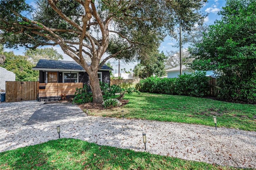 One or more photo(s) has been virtually staged. Welcome to this adorable turnkey cottage in the heart of Disston Heights. This thoughtfully updated home may be compact in size but it lives comfortably and efficiently, making it ideal as a snowbird retreat, first home, or income producing investment. Charming curb appeal greets you with a covered front porch tucked beneath a canopy of a mature live oak, complemented by a shell walkway and tropical landscaping. The updated kitchen features shaker style cabinetry, classic subway tile backsplash and stainless steel appliances, blending timeless design with everyday functionality. The ensuite bath showcases modern geometric tile flooring along with a tub and tiled surround for a fresh, stylish finish. New luxury vinyl plank flooring was installed in 2026, and major system updates including a roof and HVAC replaced in 2022 provide peace of mind for years to come. The fully fenced backyard offers a private outdoor retreat complete with a back deck with washer and dryer hookups and additional storage. A parking pad provides convenient off street parking for two vehicles. Skip the condo fees and enjoy the pride and privacy of true homeownership! Located high and dry in central Pinellas County, you are perfectly positioned between vibrant downtown St. Petersburg and the world renowned beaches of St. Pete Beach. Spend your days exploring waterfront parks, marinas, art galleries, acclaimed restaurants, and year round events downtown, then head west for powdery sand, Gulf breezes, beachside dining and unforgettable Florida sunsets. Charming, low maintenance, and centrally located, this Disston Heights gem is ready to welcome its next owner.