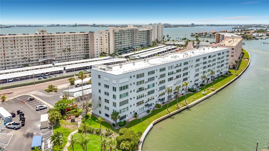 Welcome to this 1st floor unit in Town Shores 55+ Waterfront Community.  Beautifully updated 2 BEDROOM / 2 BATH condo. A new roof was completed in 2025 along with new carports. New electric panel along with new HVAC unit and Hurricane impact Front and Back door along with new appliances & kitchen cabinets. Town Shores sits directly on Boca Ciega Bay. Relax with morning coffee or evening sunset from your Florida room & outdoor patio area with peaceful marina views and dolphins. The many amenities include shuffleboard, billiards, a fitness center, cardroom, tennis and pickleball courts, along with 4 heated pools. The Marina offers boat slips, docks, a kayak launch and fishing. The quaint village of Gulfport is a short stroll to the many restaurants, Tuesday market, shopping, a vibrant nightlife, and Gulfport Beach.