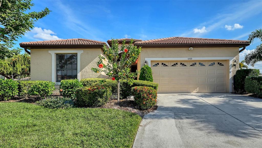 Photo of 4160 Mackay Falls Terrace, Sarasota, FL 34243 (MLS # A4672916)